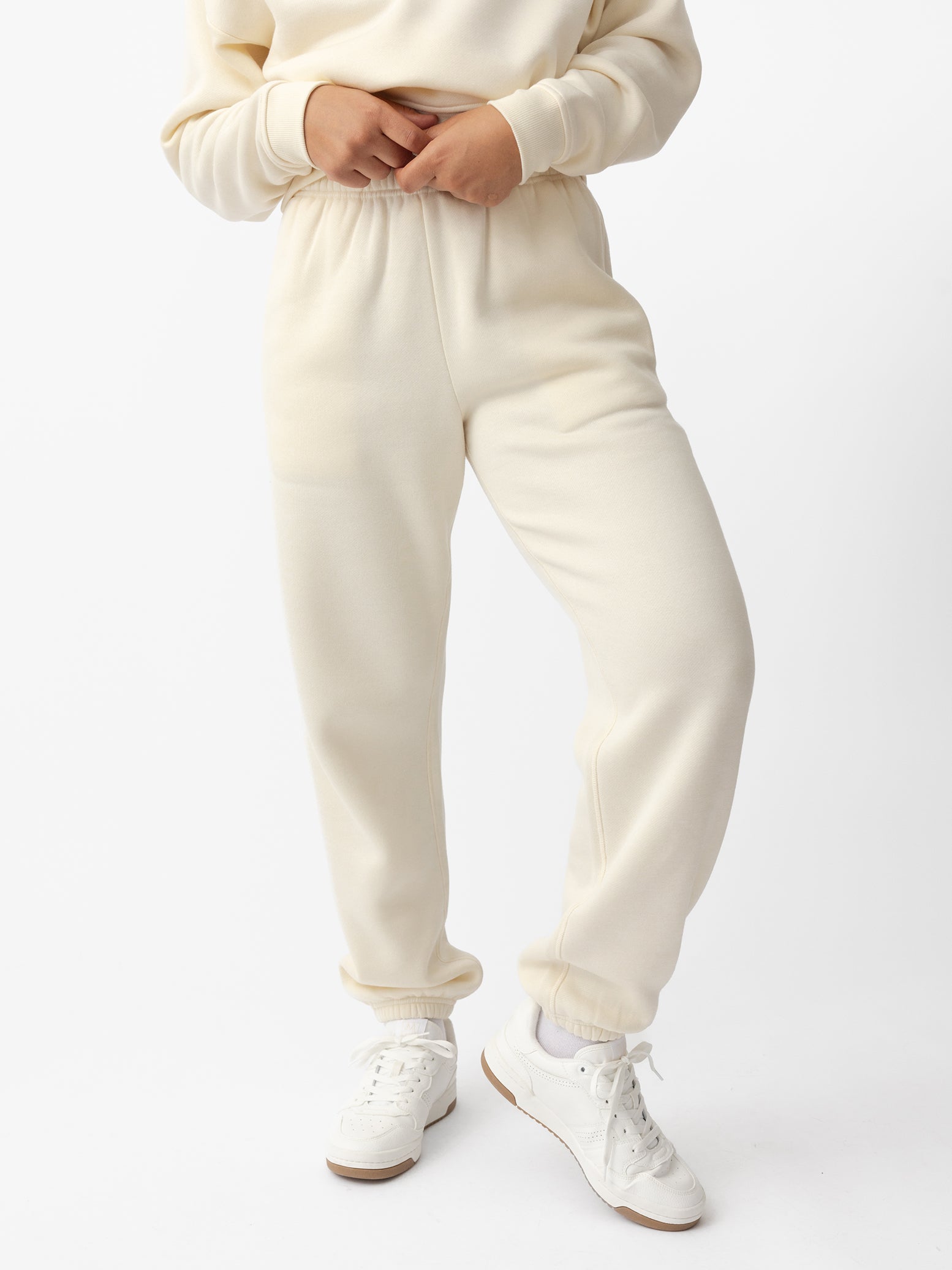Woman wearing Alabaster CityScape Sweat Pant with white background |Color: Alabaster