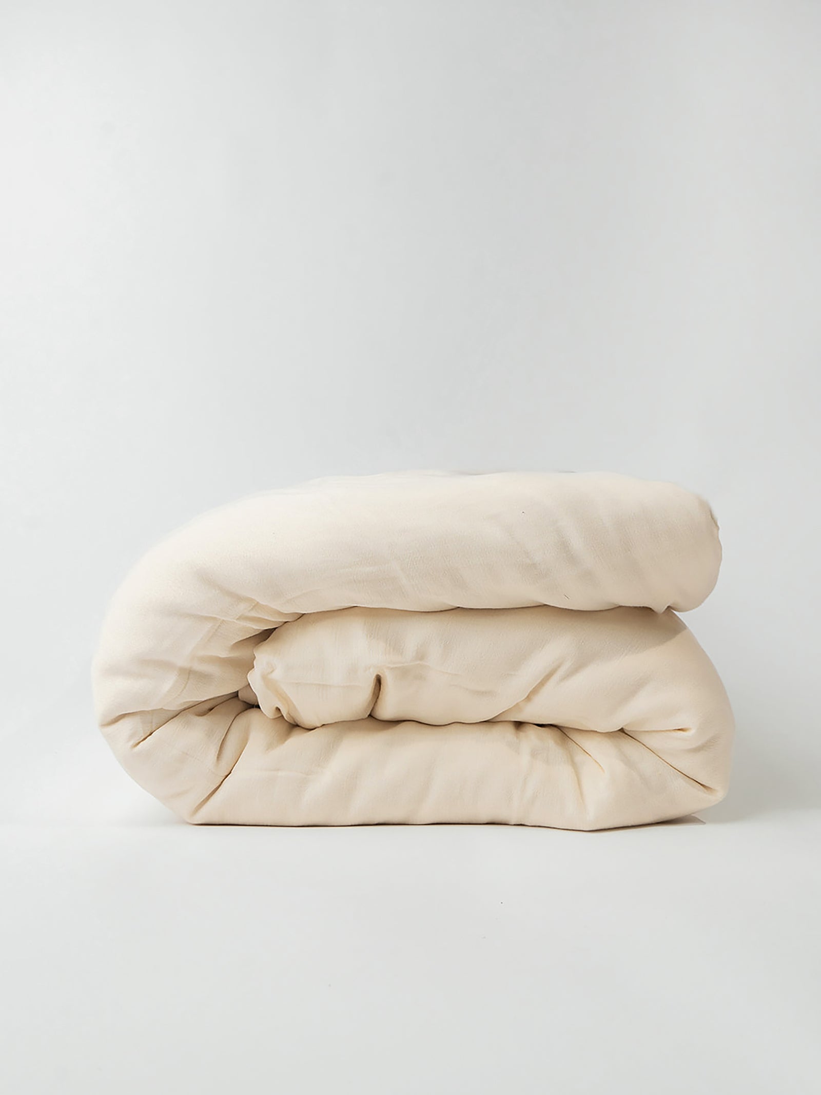 Buttermilk Aire Bamboo Duvet Cover. The Duvet Cover has been photographed with a white background.