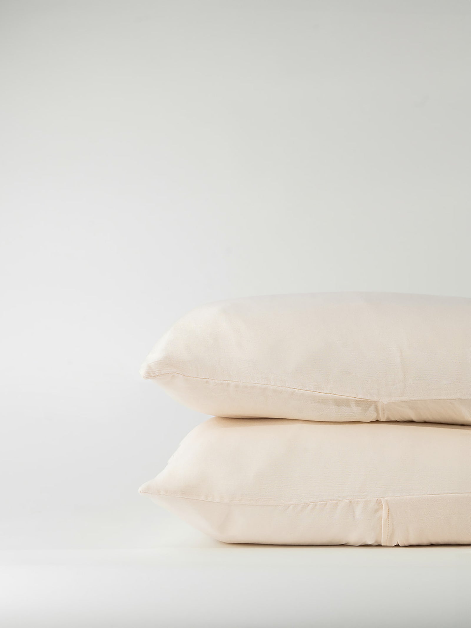 Buttermilk Aire Bamboo Shams. The shams are photographed with a white background