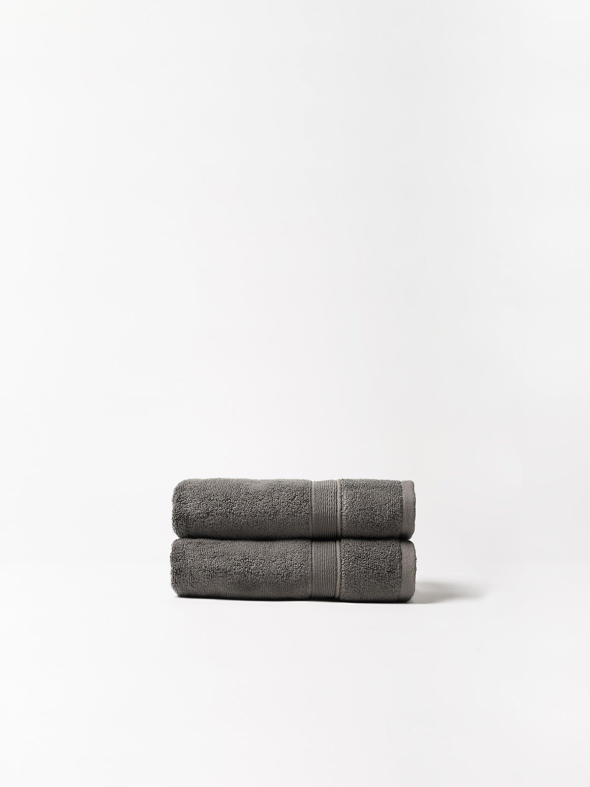 Charcoal hand towels folded with white background 
