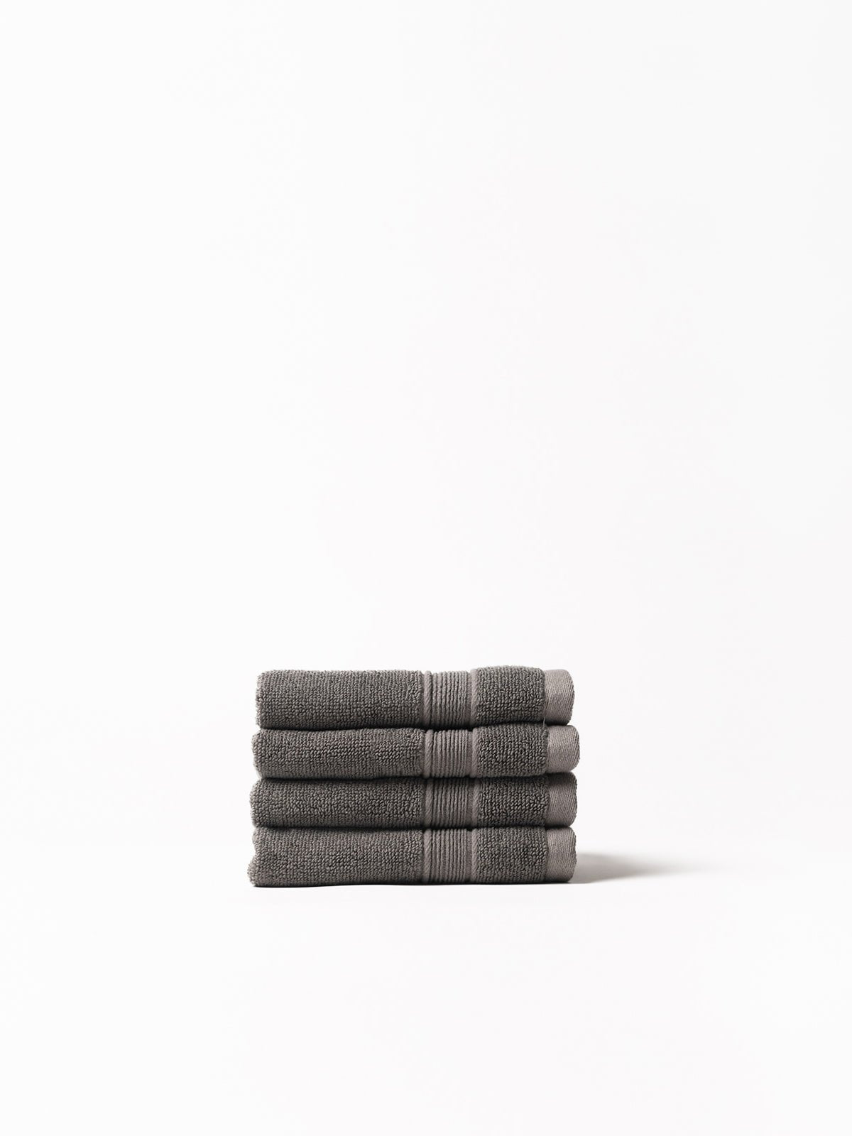 Charcoal washcloths folded with white background 