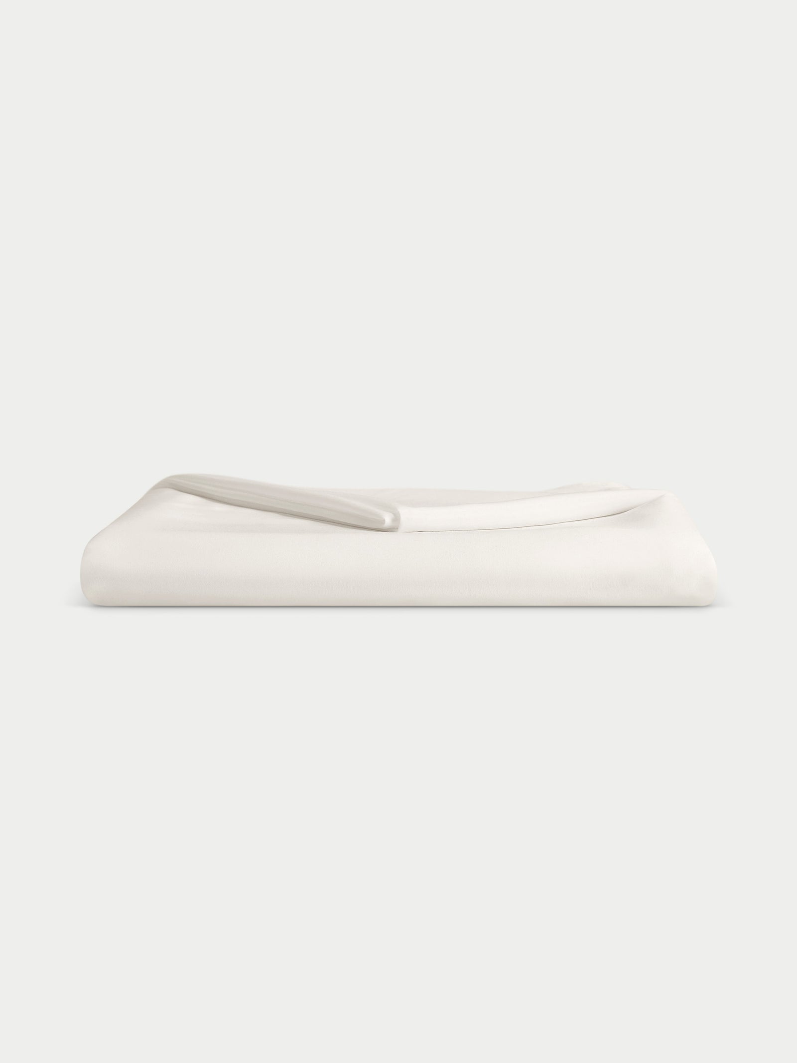 Creme top sheet folded with white background 