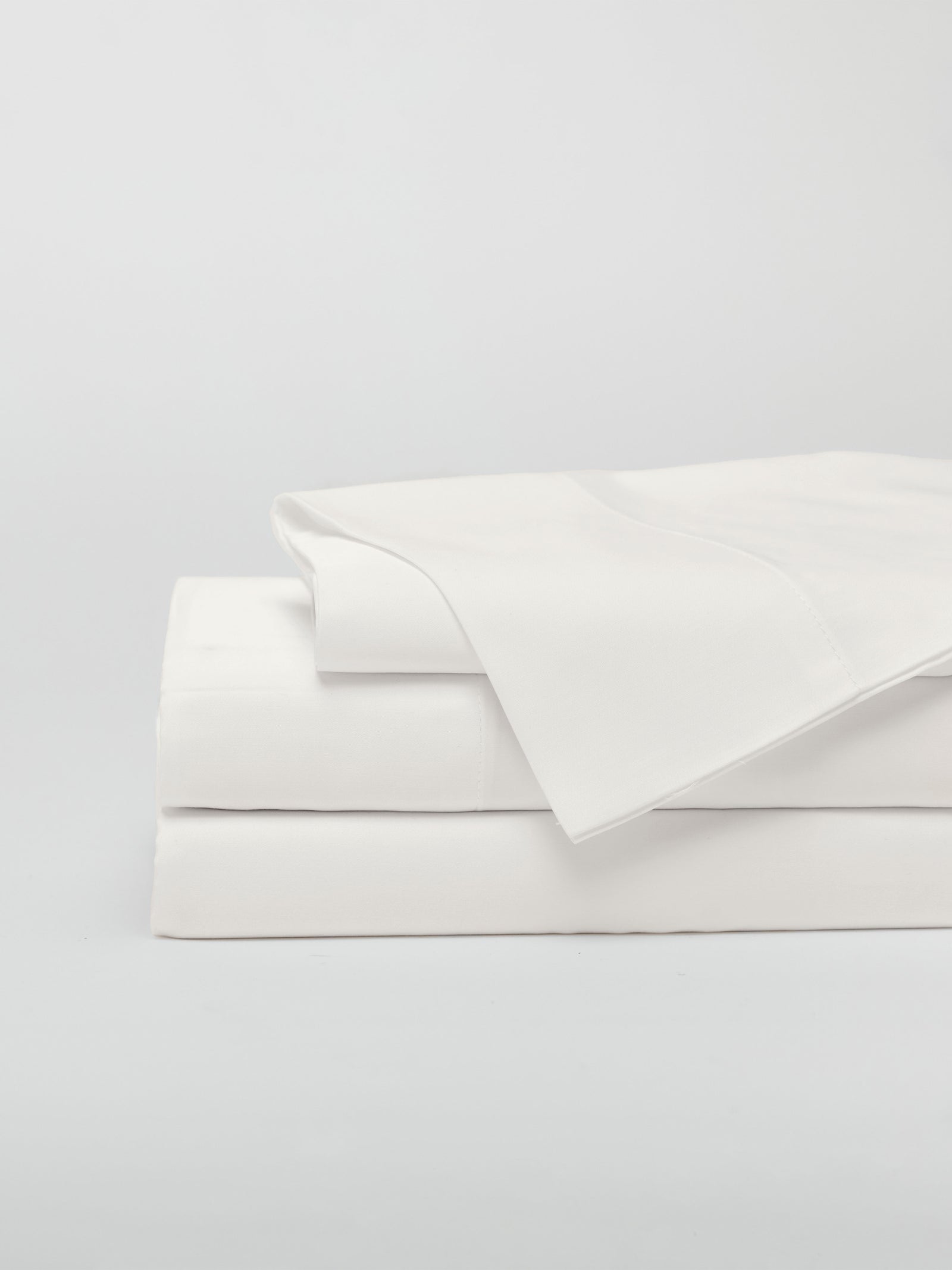 Creme sheet set folded with white background 