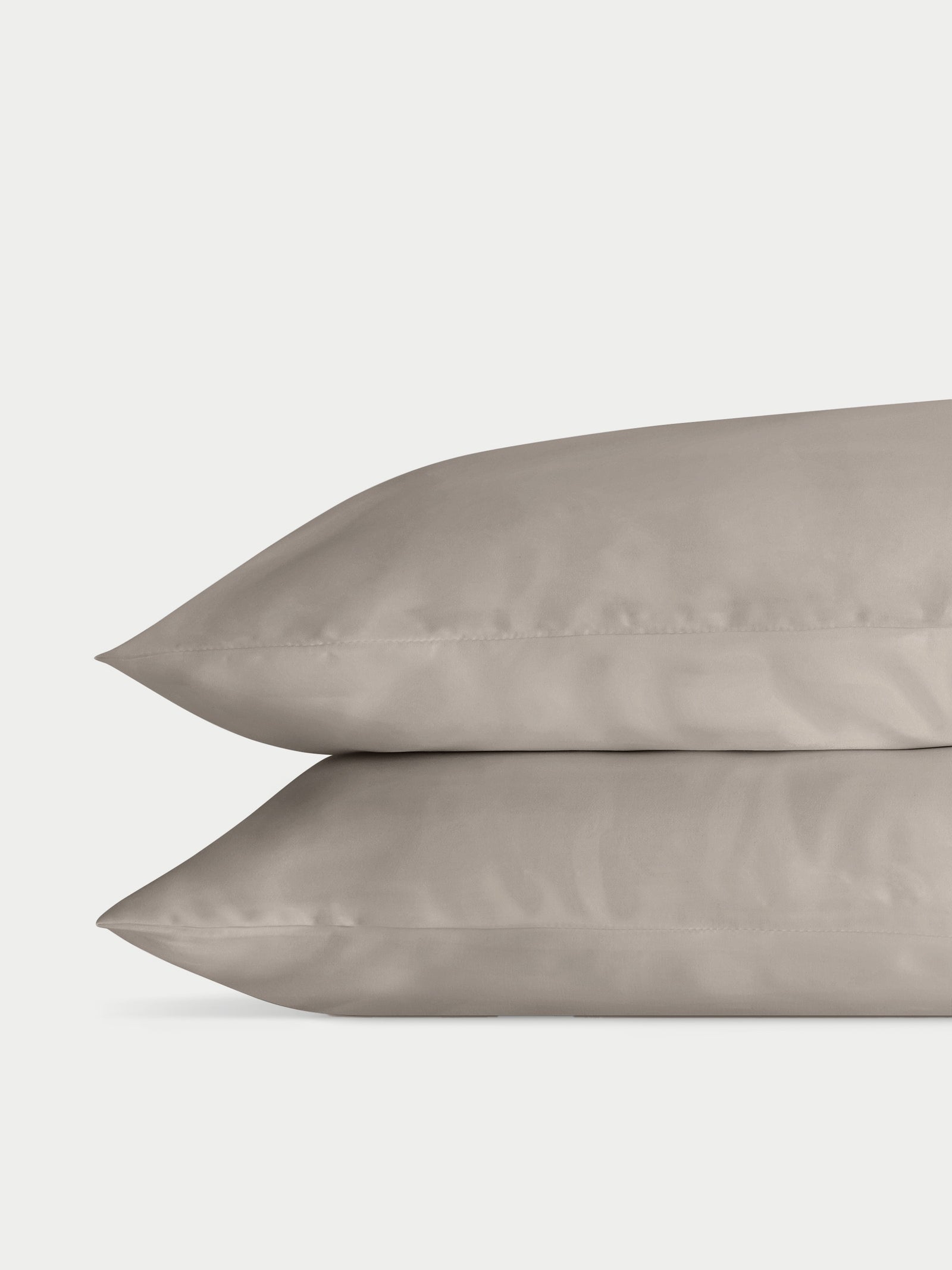Two dove grey pillowcases with plain background standard/king/body
