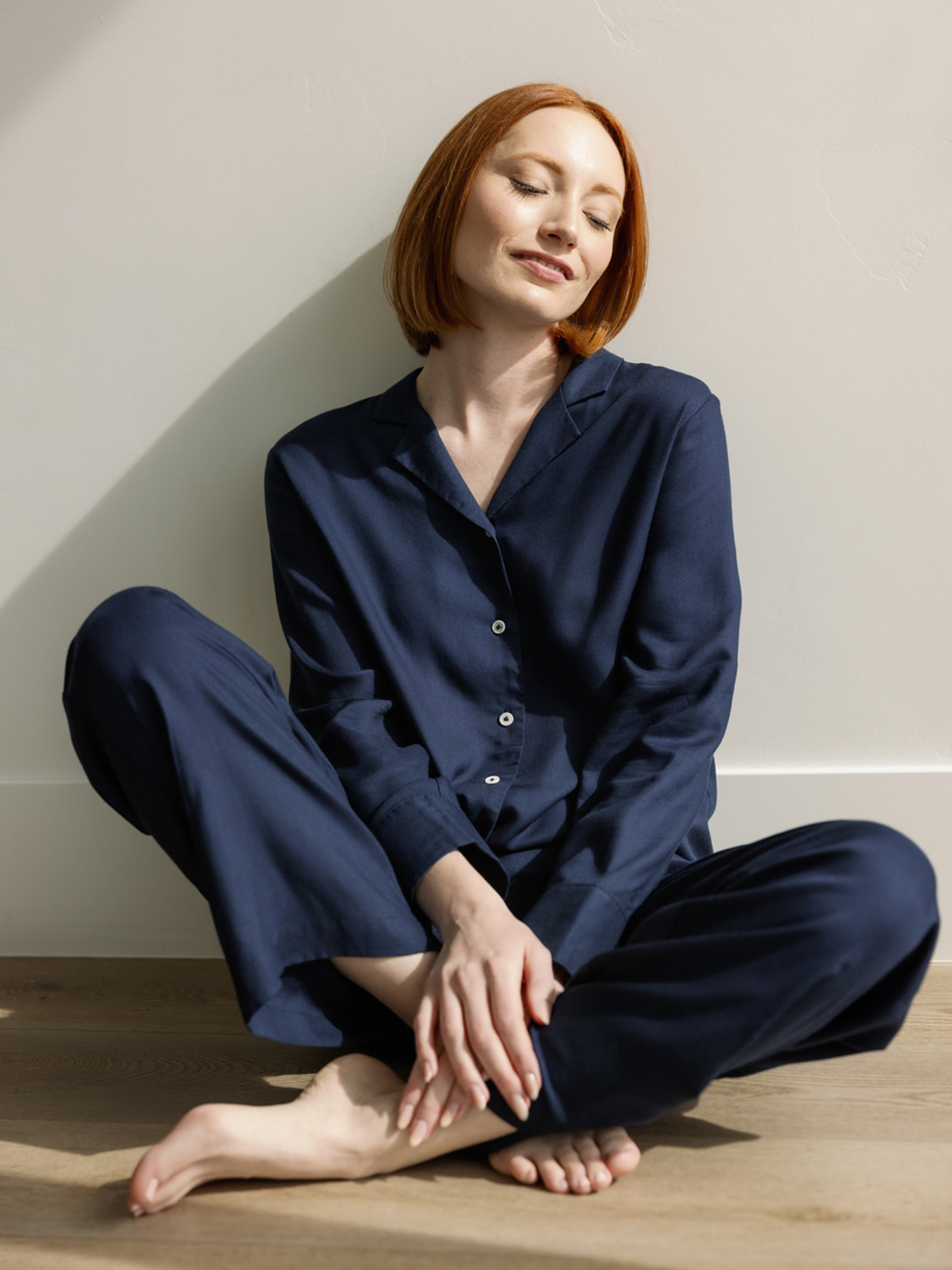 Woman in soft woven eclipse pajama set sitting on the floor |Color:Eclipse