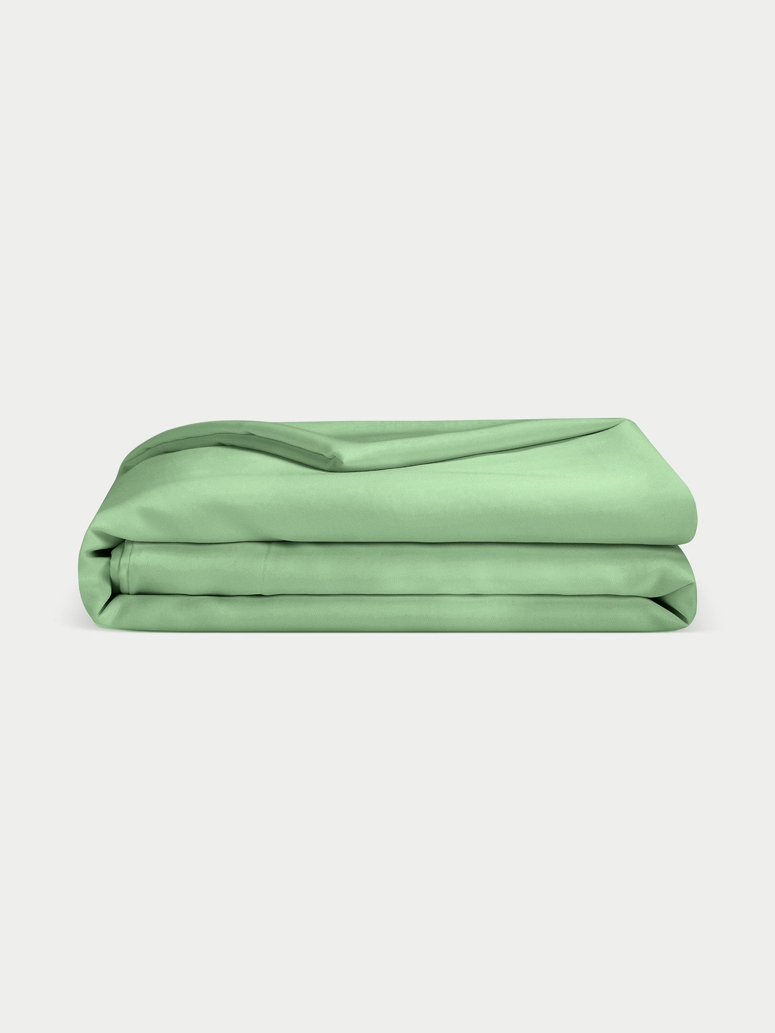 Fern Bamboo Duvet Cover neatly folded. Photo taken with white background.