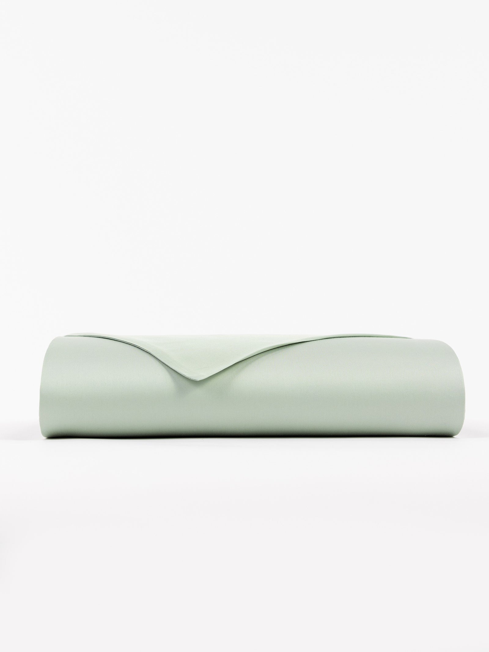A neatly folded, Cozy Earth Bamboo Flat Sheet in soft light green set against a plain white background.