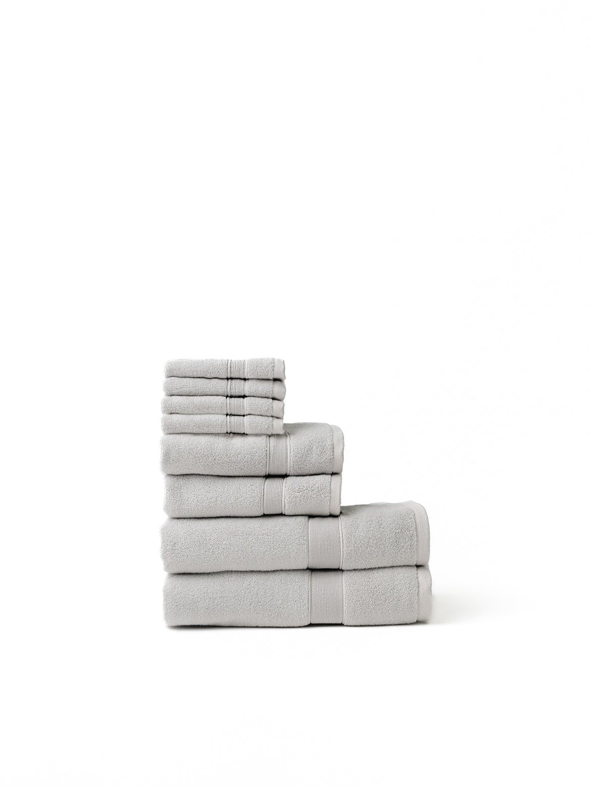 Light grey luxe bath towel set folded with white background 