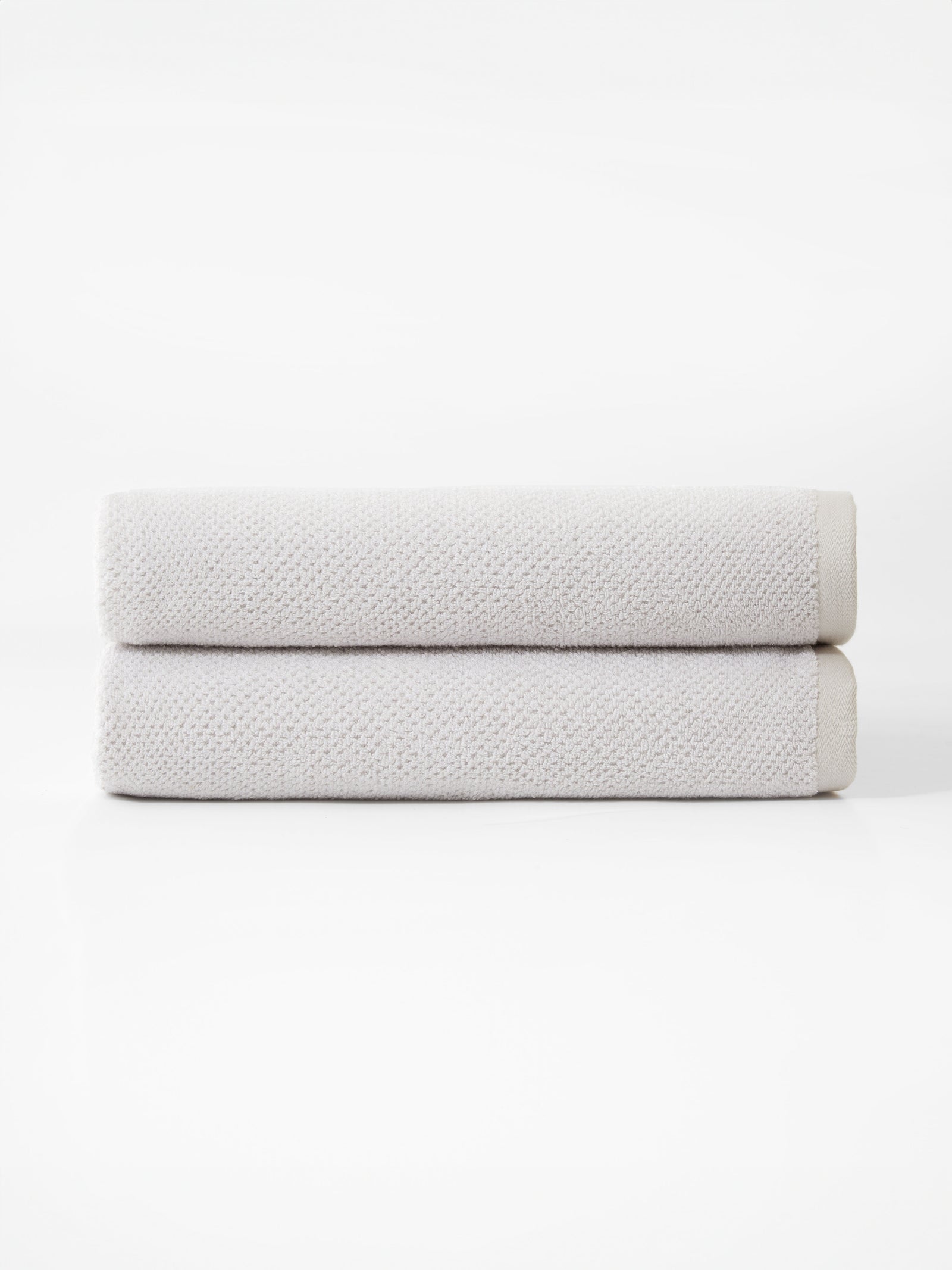 Nantucket Bath Towels in the color Heathered Light Grey. Photo of Nantucket Bath Towels taken with the bath towels on a white background. 