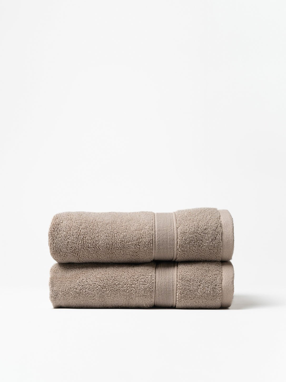 Sand hand towels folded with white background 