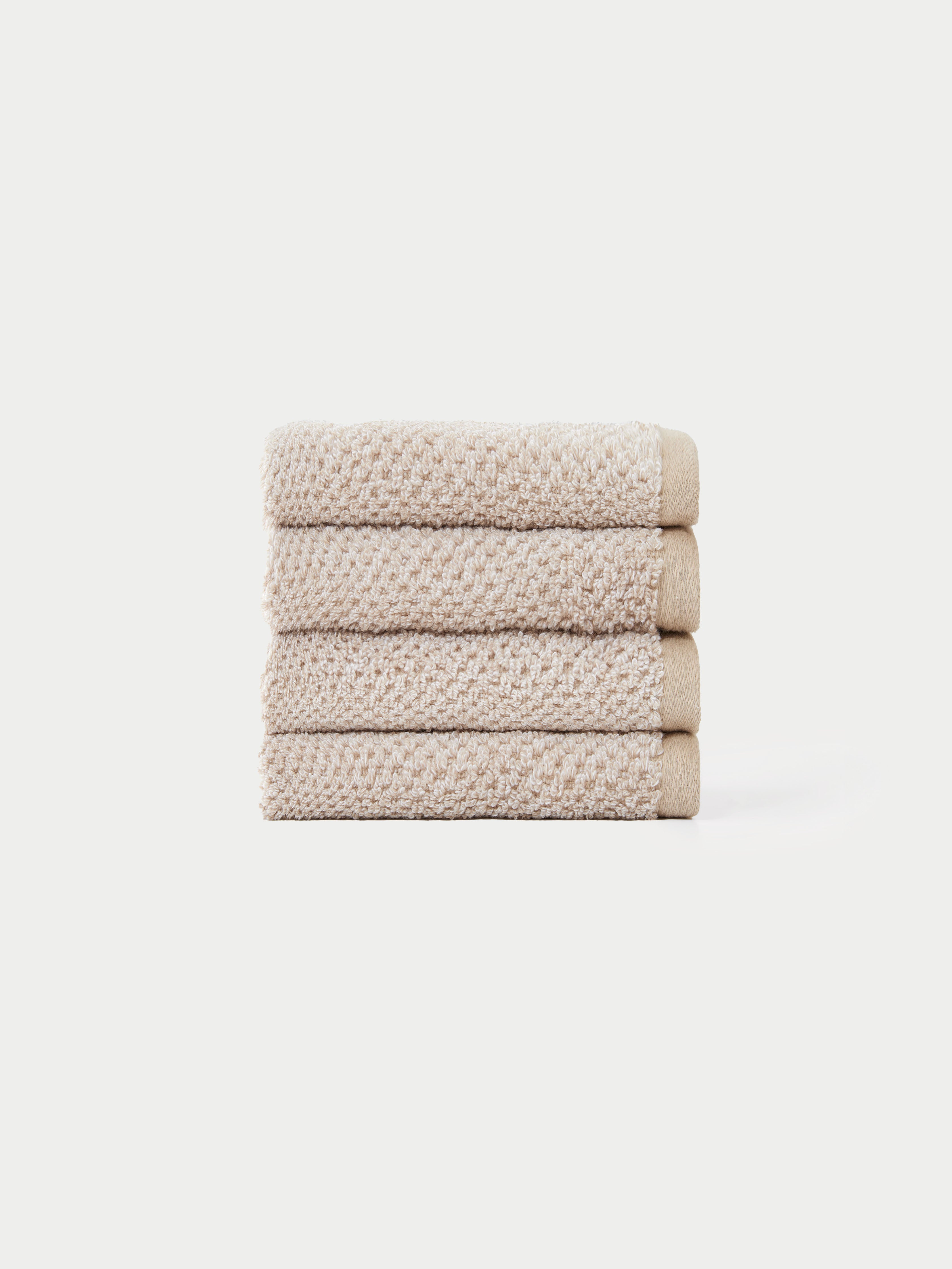 Nantucket Wash Cloths in the color Heathered Sand. The Wash Cloths are neatly folded. The photo of the wash cloths was taken with a white background.|Color:Heathered Sand