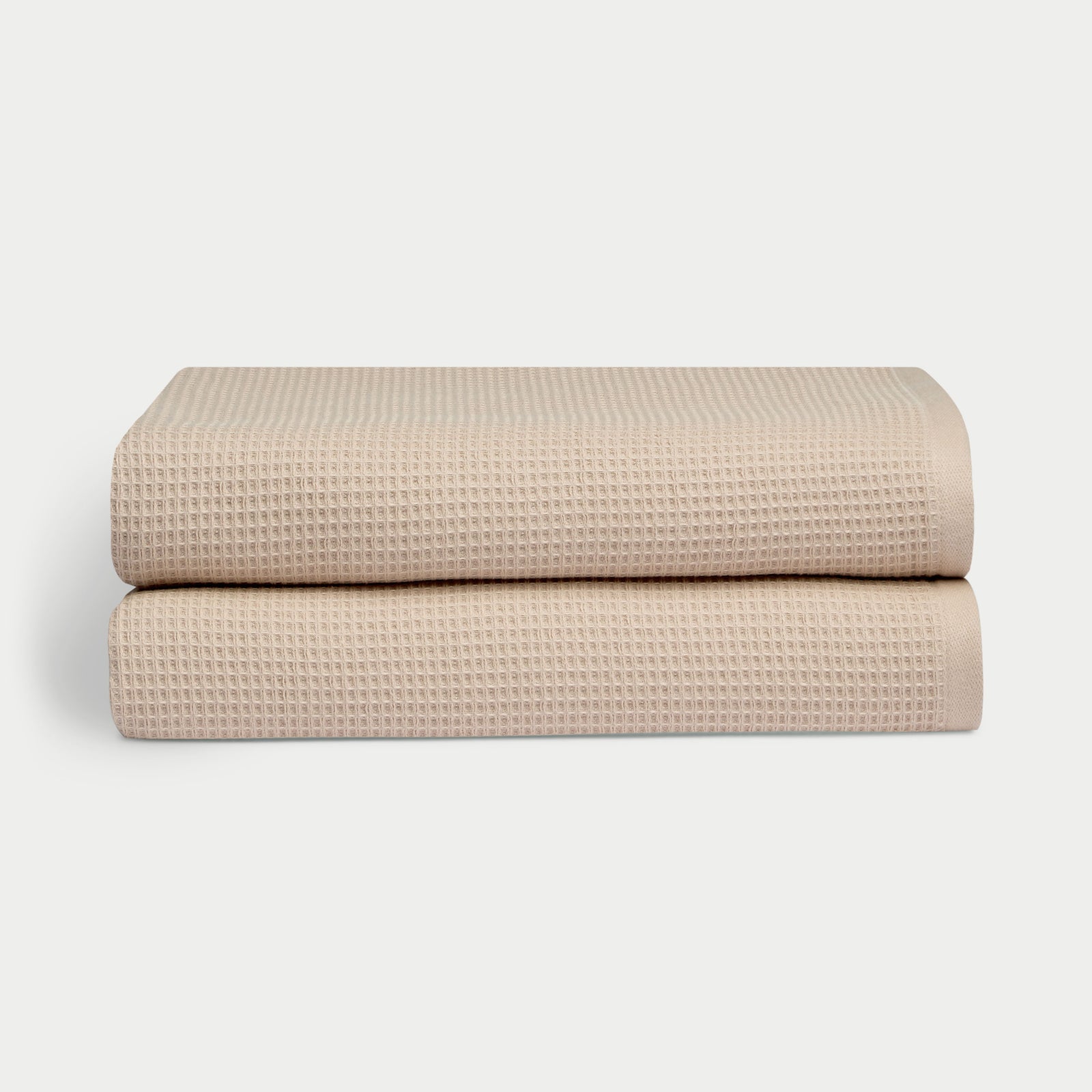 Waffle Bath Sheets in the color sand. Photo of Waffle Bath Sheets taken with white a background.