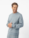 Man wearing Smokey Blue cityscape crewneck with white background |Color:Smokey Blue