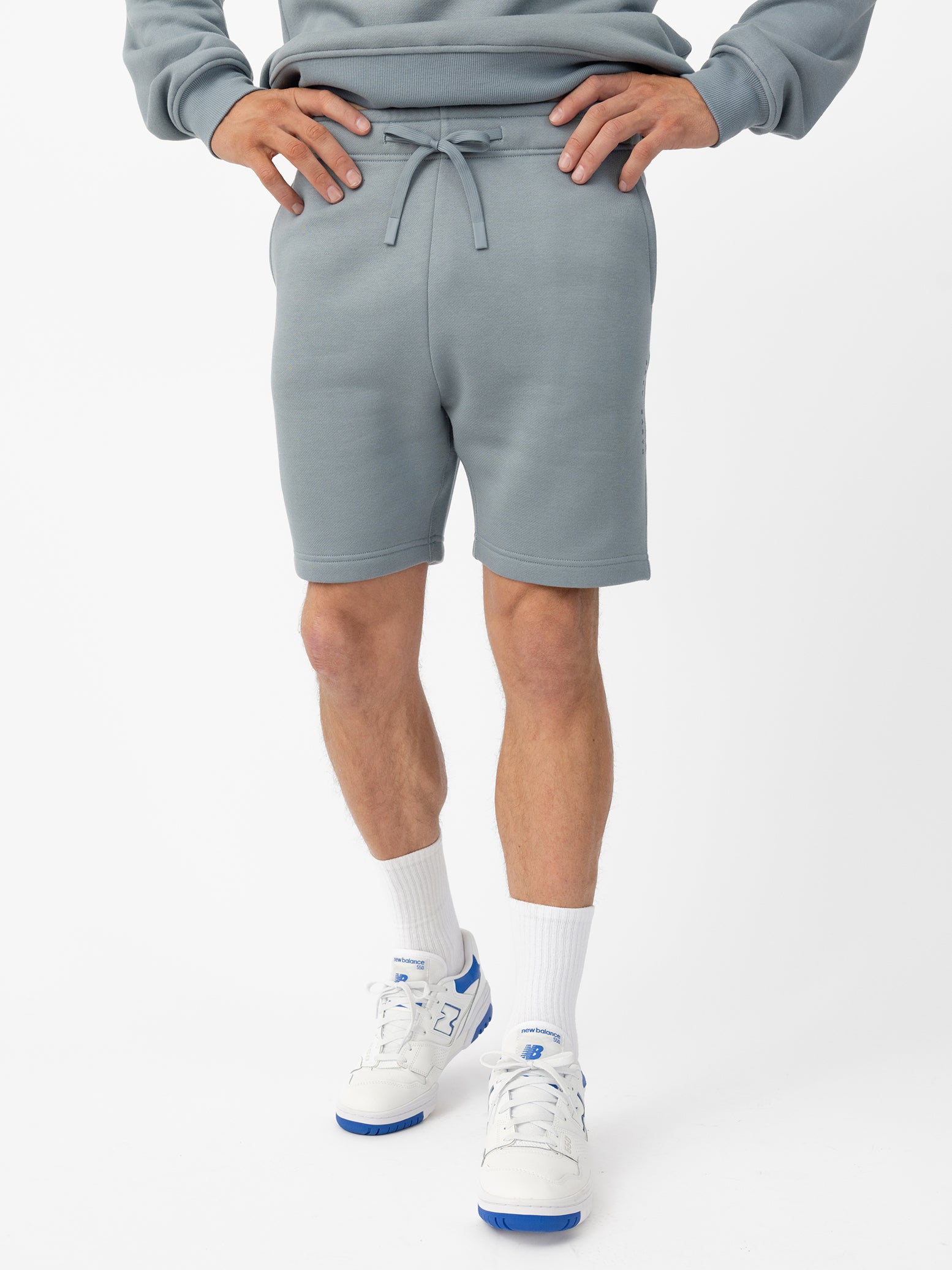 Man wearing Smokey Blue CityScape Shorts with white background