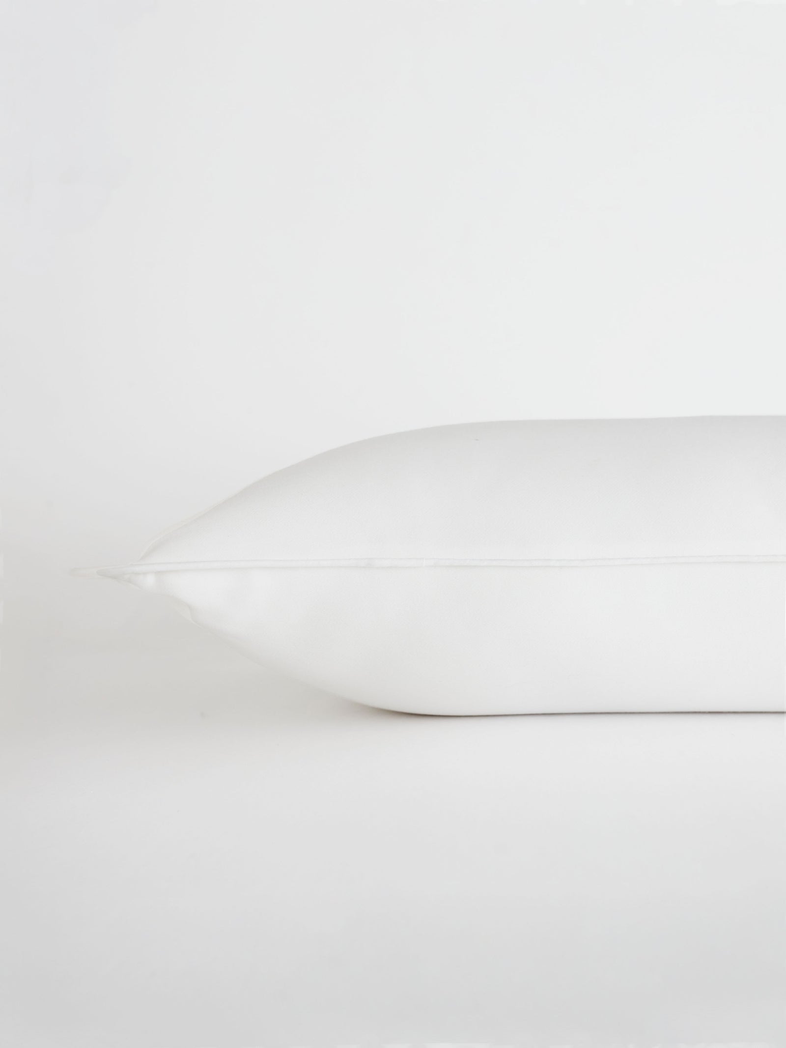 Travel size down pillow with white background