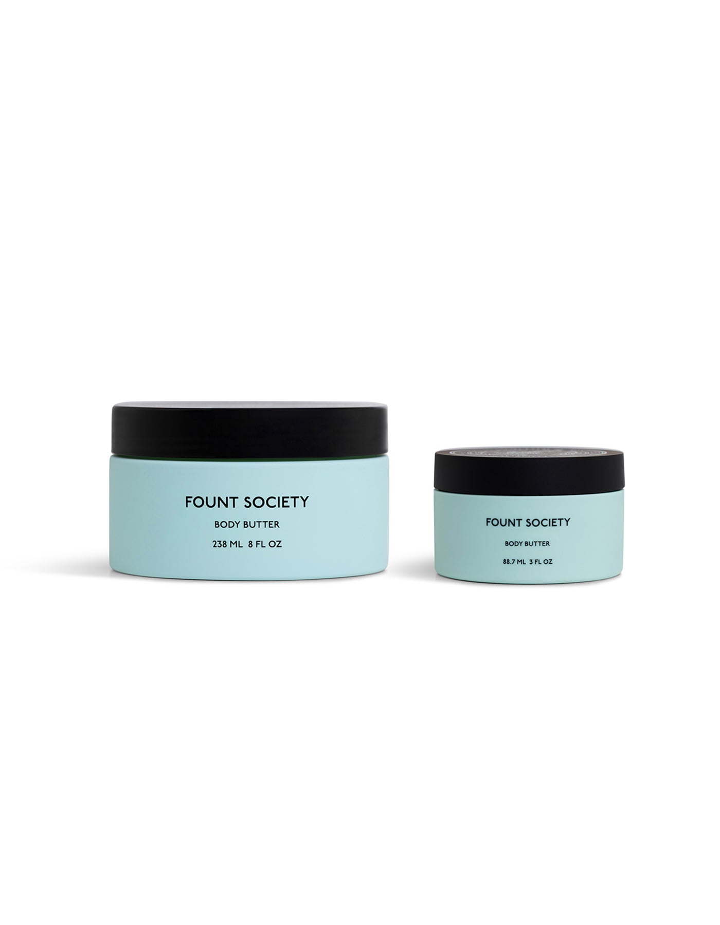 Two light blue Cozy Earth Body Butter jars with black lids are shown on a white background. The left jar is 238 mL/8 fl oz, while the right jar is 89 mL/3 fl oz.