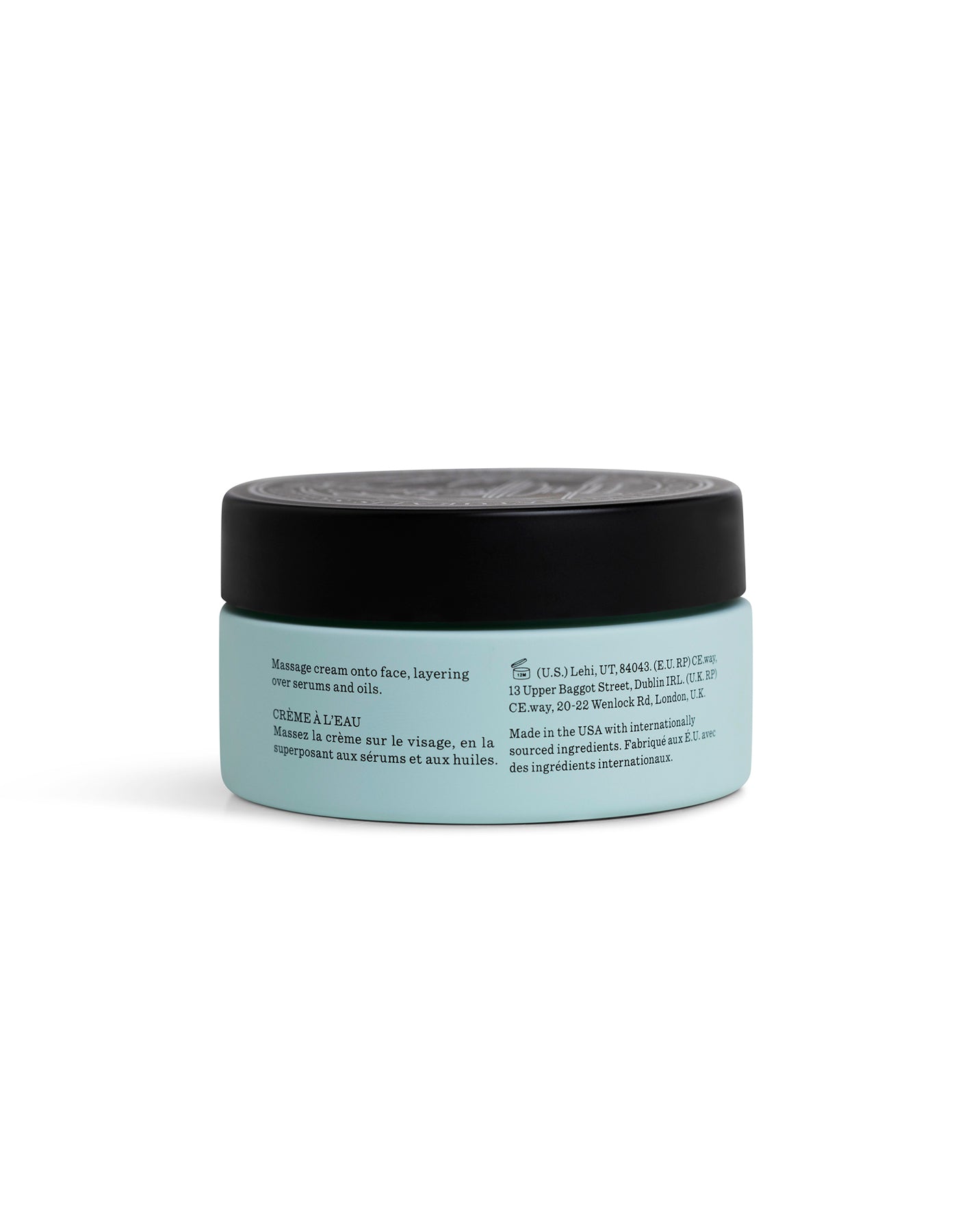 A light blue jar with a black lid contains Cozy Earth Water Cream Moisturizer. The label features product instructions and manufacturing details printed in English and French.