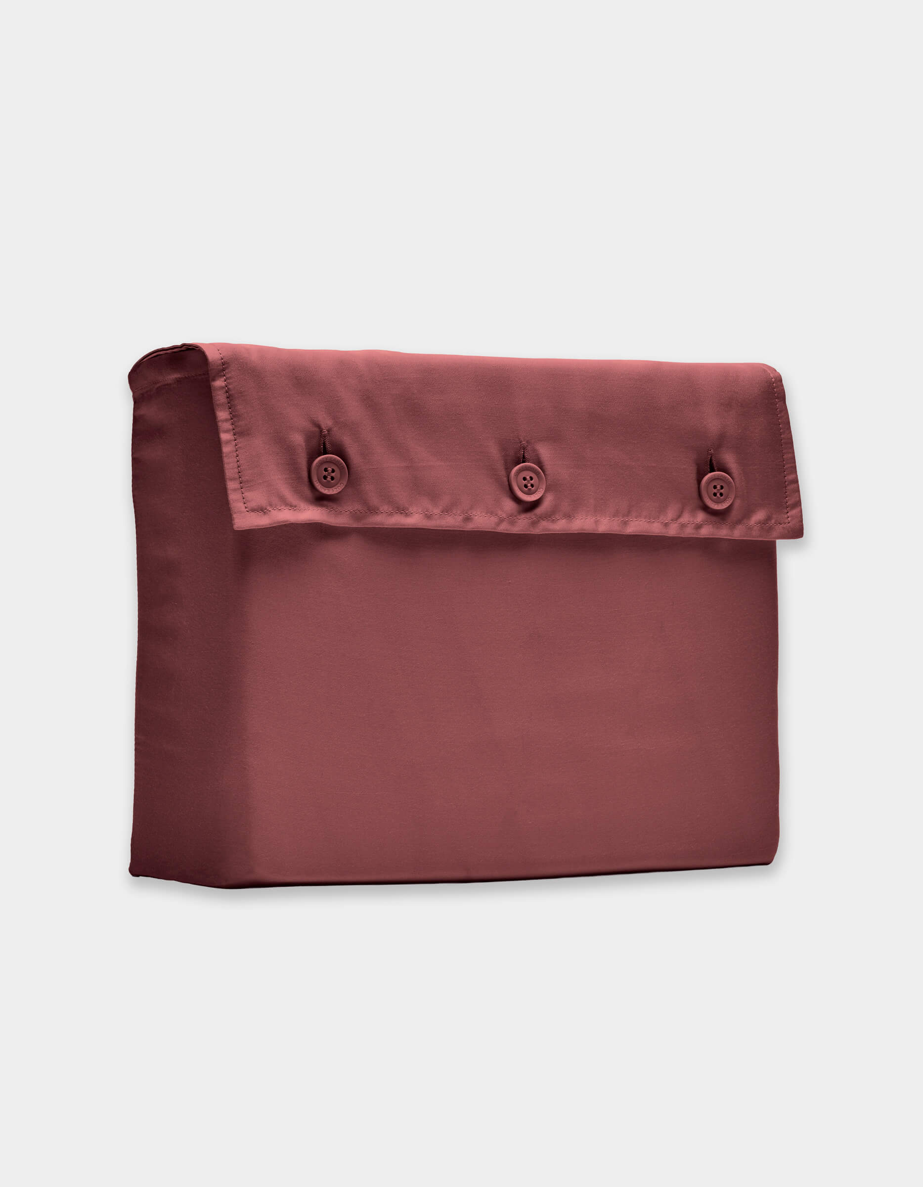 The Cozy Earth Bamboo Sheet Set is displayed against a plain light background, highlighting its rectangular maroon fabric pouch with a flap secured by three front buttons.|Color:Mulberry