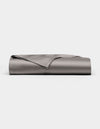 A neatly folded, smooth Cozy Earth Bamboo Flat Sheet in grey is displayed against a plain white background.|Color:Charcoal