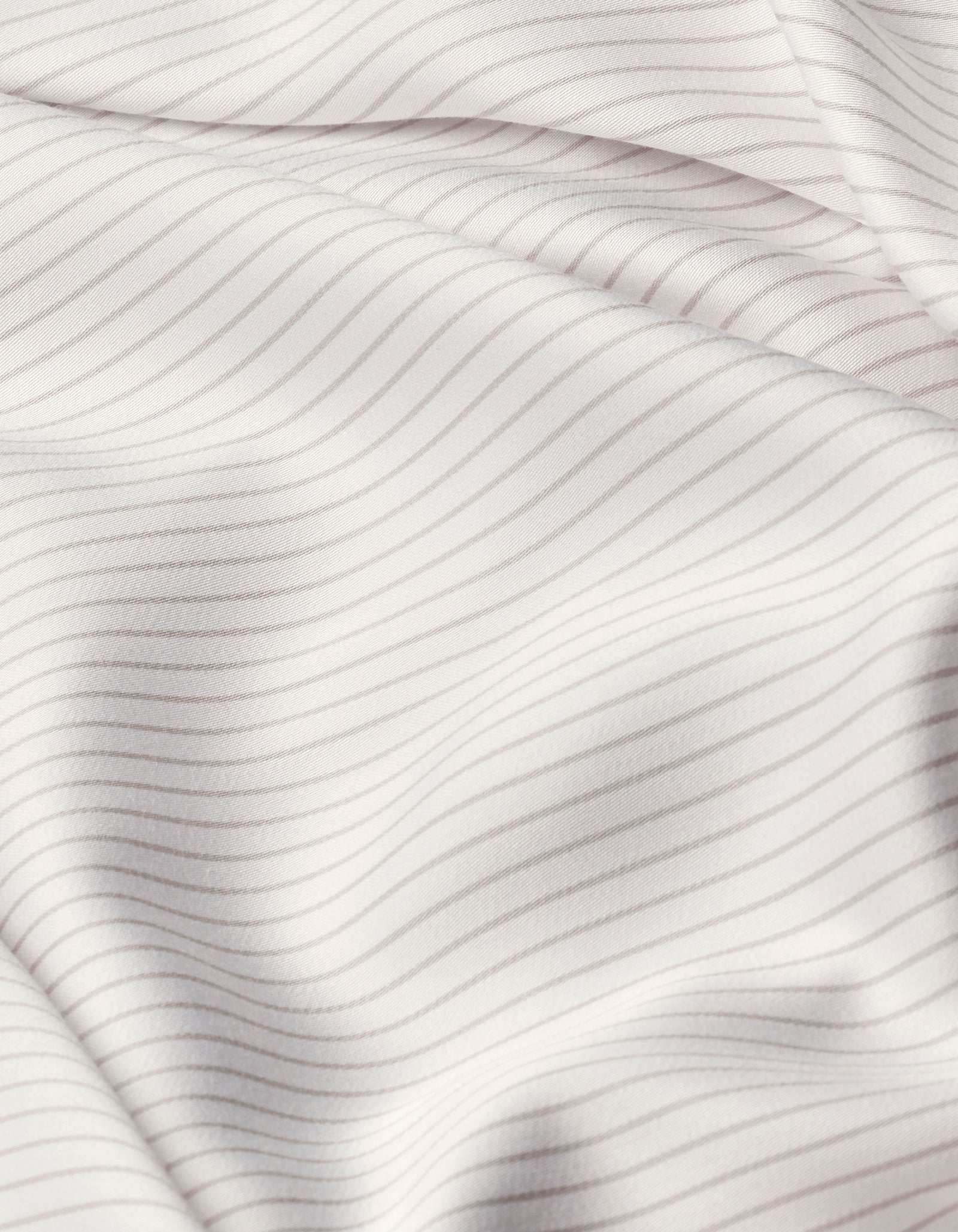 Close-up of Cozy Earth Bamboo Sheet Set’s white fabric with thin, evenly spaced light gray horizontal stripes, featuring soft folds and a smooth texture.