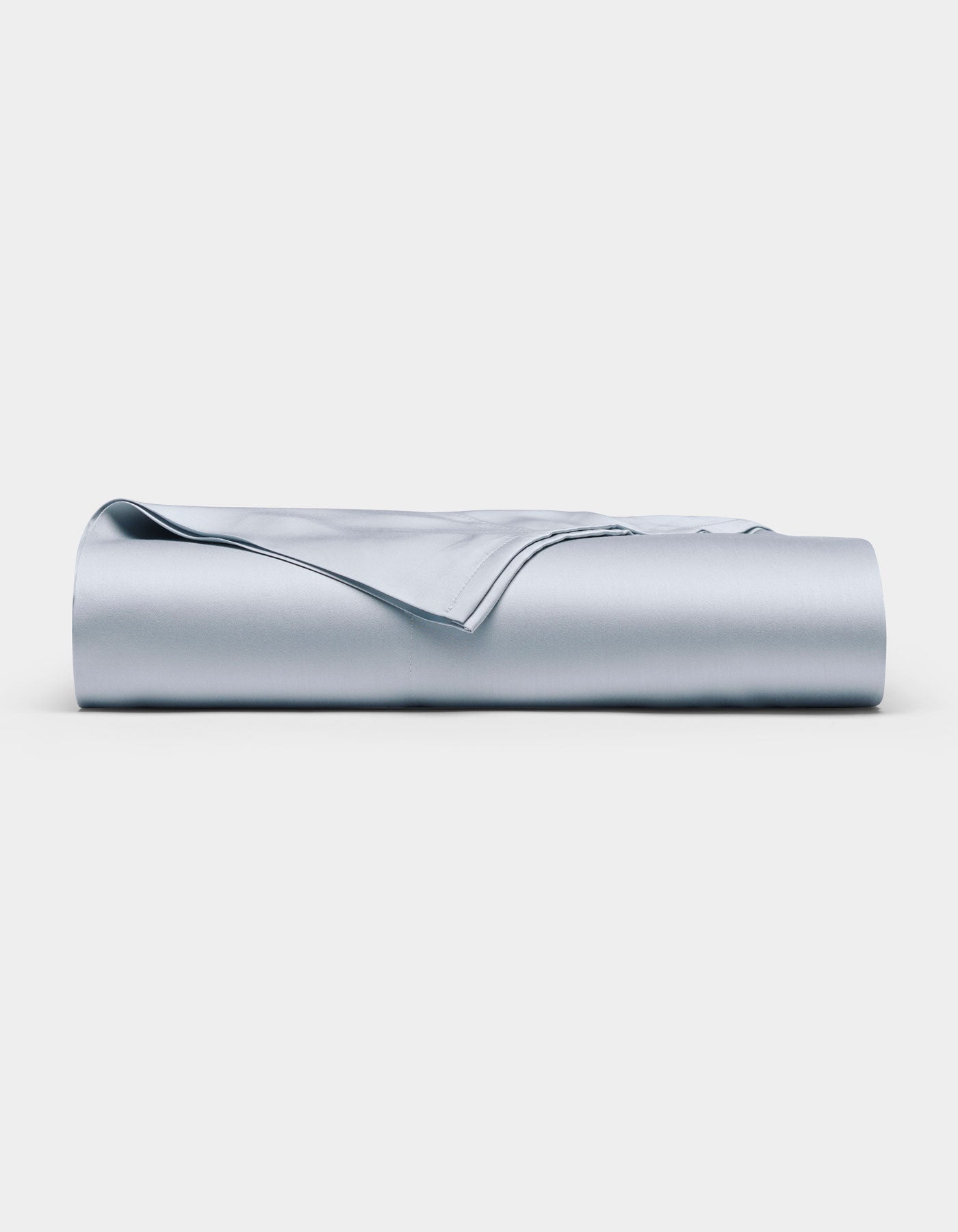 The Cozy Earth Bamboo Flat Sheet in light blue is neatly folded and displayed against a plain white background.|Color:Shore