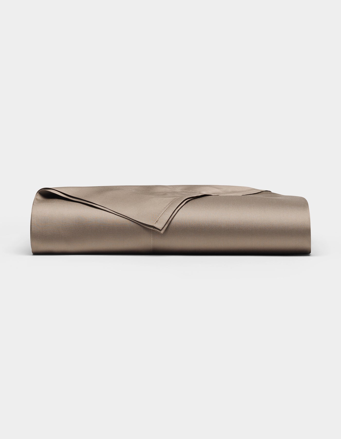 A neatly folded Bamboo Flat Sheet by Cozy Earth in taupe is displayed on a plain white background.|Color:Walnut
