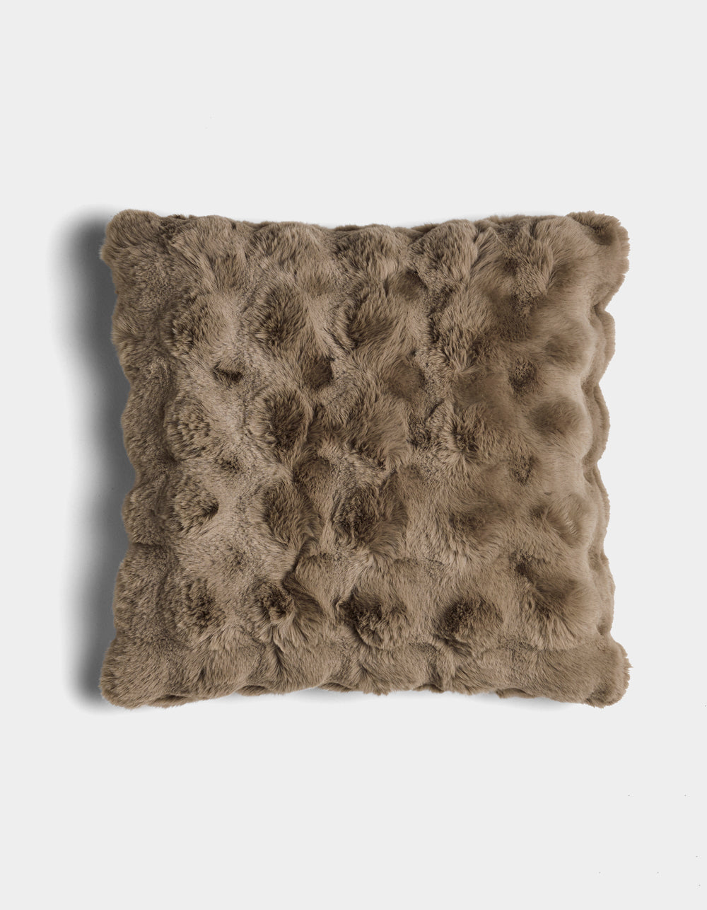 The Bubble Cuddle Pillow by Cozy Earth is a square, brown faux fur pillow with a textured, tufted surface, shown against a white background.|Color:Walnut |Size:24" x 24"