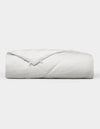 The Cozy Earth Bamboo Viscose Comforter, featuring a quilted design, is neatly folded and displayed against a plain white background. |Filling:Extra