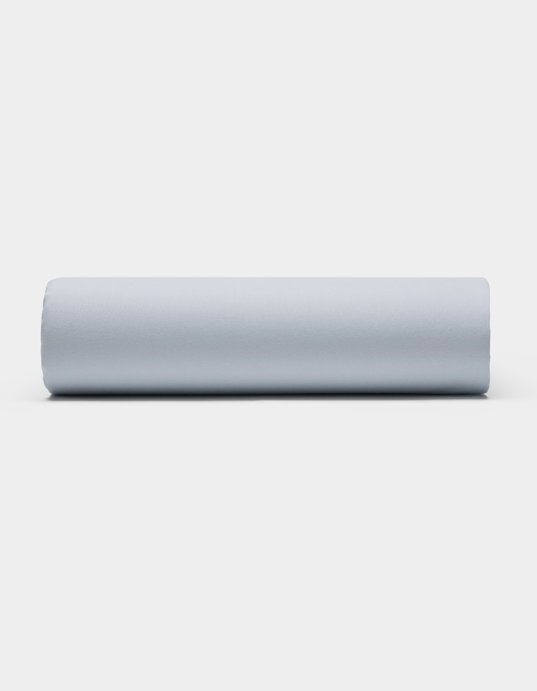 A Cozy Earth Soft-Wash Cotton Fitted Sheet in light gray is displayed lying flat on a plain white background, viewed from above.|Color:Shore