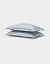Two Cozy Earth Soft-Wash Cotton Quilted Shams in light gray are stacked neatly against a plain white background.|Color:Shore