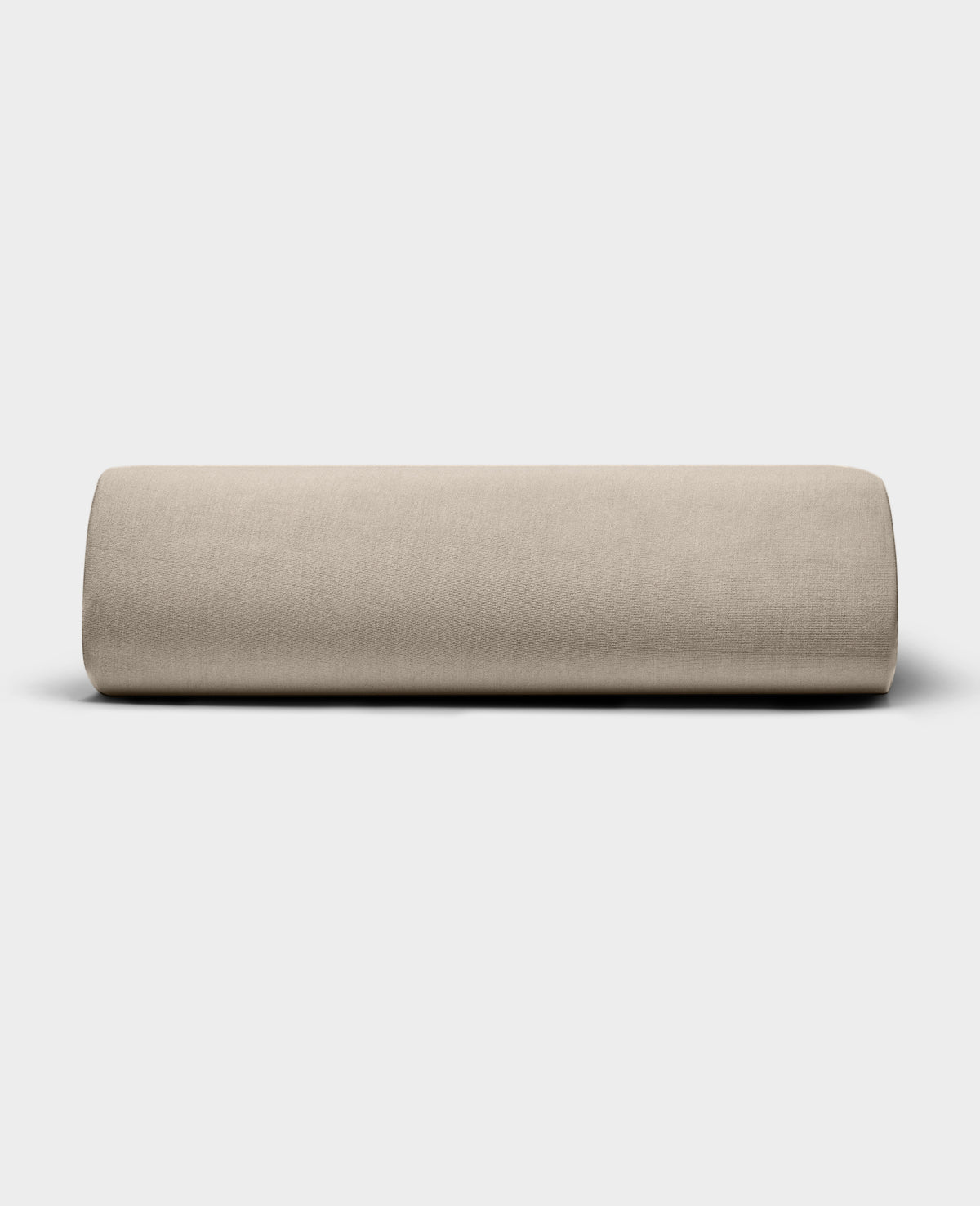 The Bamboo Jersey Fitted Sheet by Cozy Earth, shown in light beige with a smooth fabric texture, is displayed against a plain white background.|Color:Driftwood