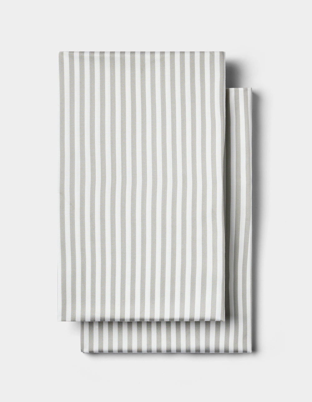 Two neatly folded Cozy Earth Bamboo Pillowcases in white with vertical light gray stripes, displayed on a plain white background.|Color:Classic Stripe in Laurel