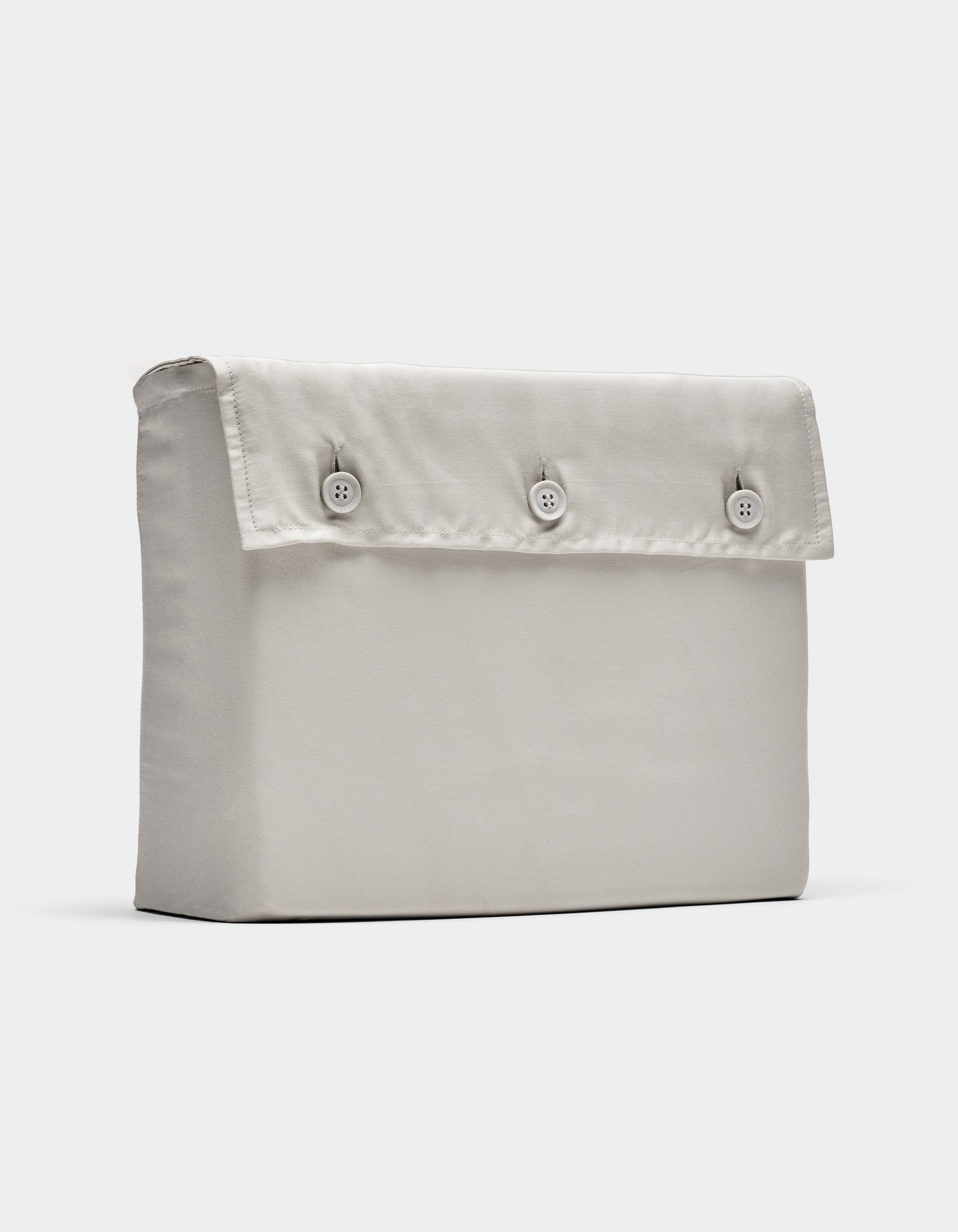 The Cozy Earth Bamboo Sheet Set, shown in light beige, is displayed folded with a rectangular fabric pouch and flap secured by three front buttons, photographed against a plain white background.|Color:Light Grey