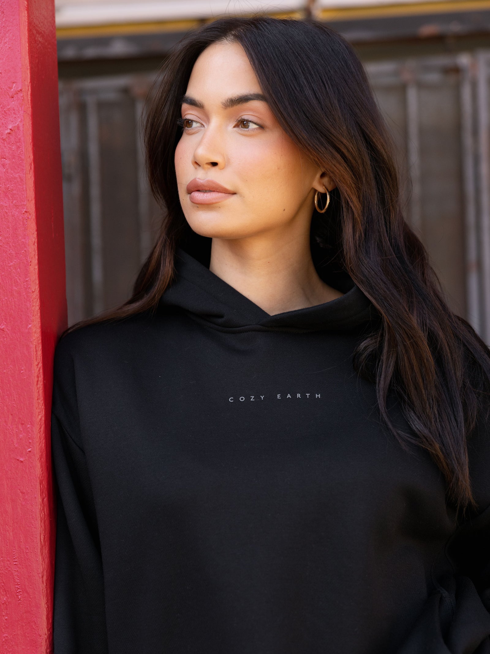 Close up of woman wearing black cityscape hoodie