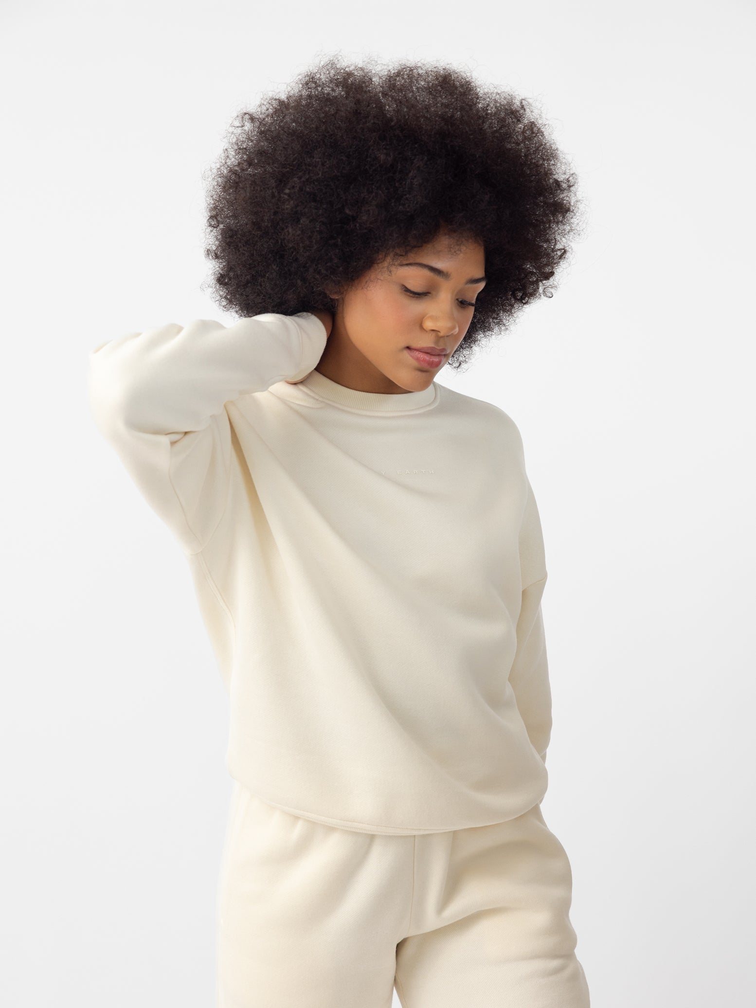Woman wearing Alabaster CityScape Crewneck with white background
