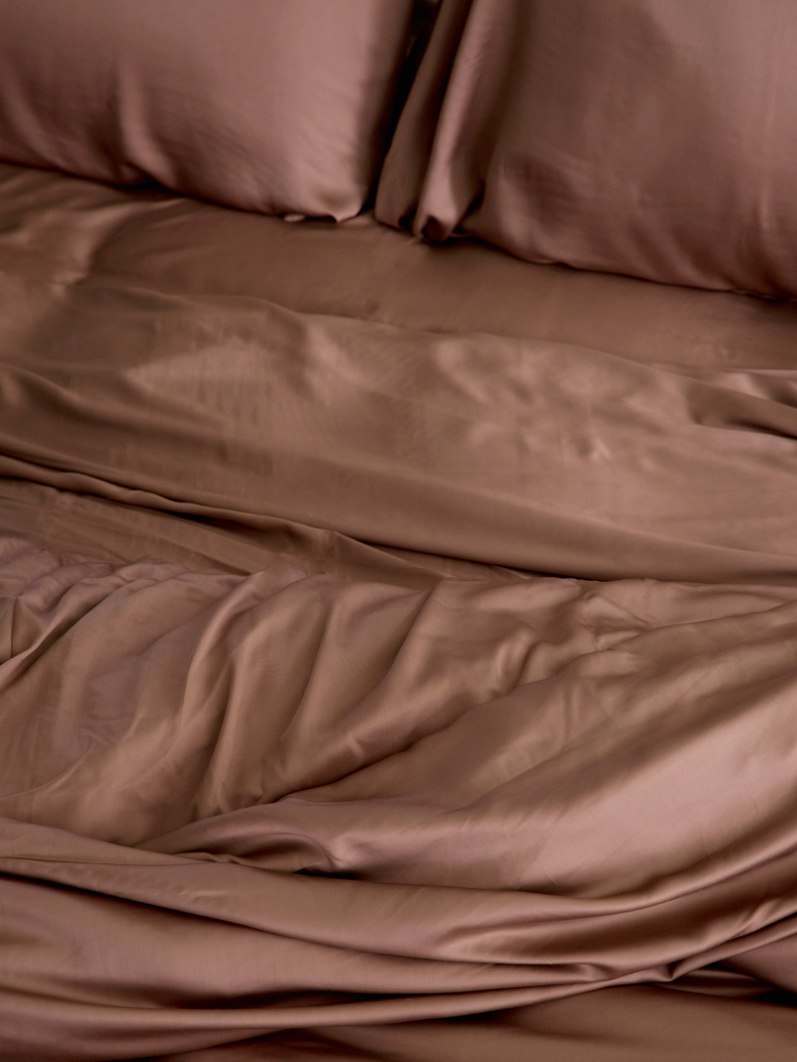 Close up of clay bedding on an unmade bed 