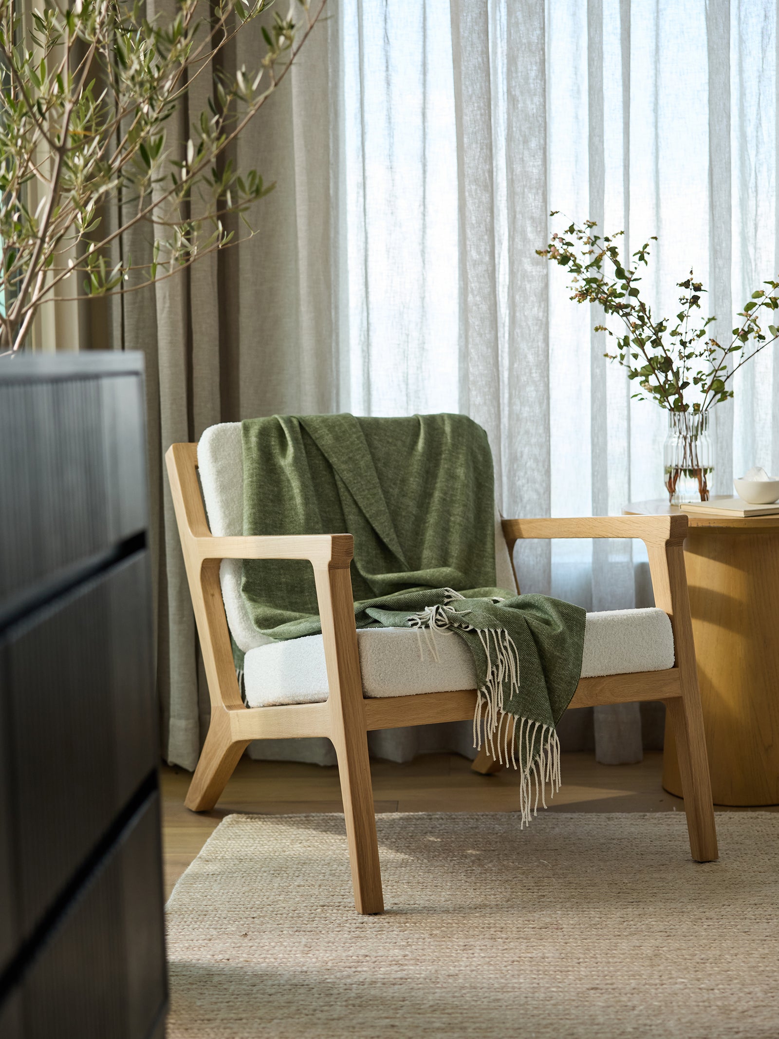 Ivy herringbone tassel throw draped over accent chair