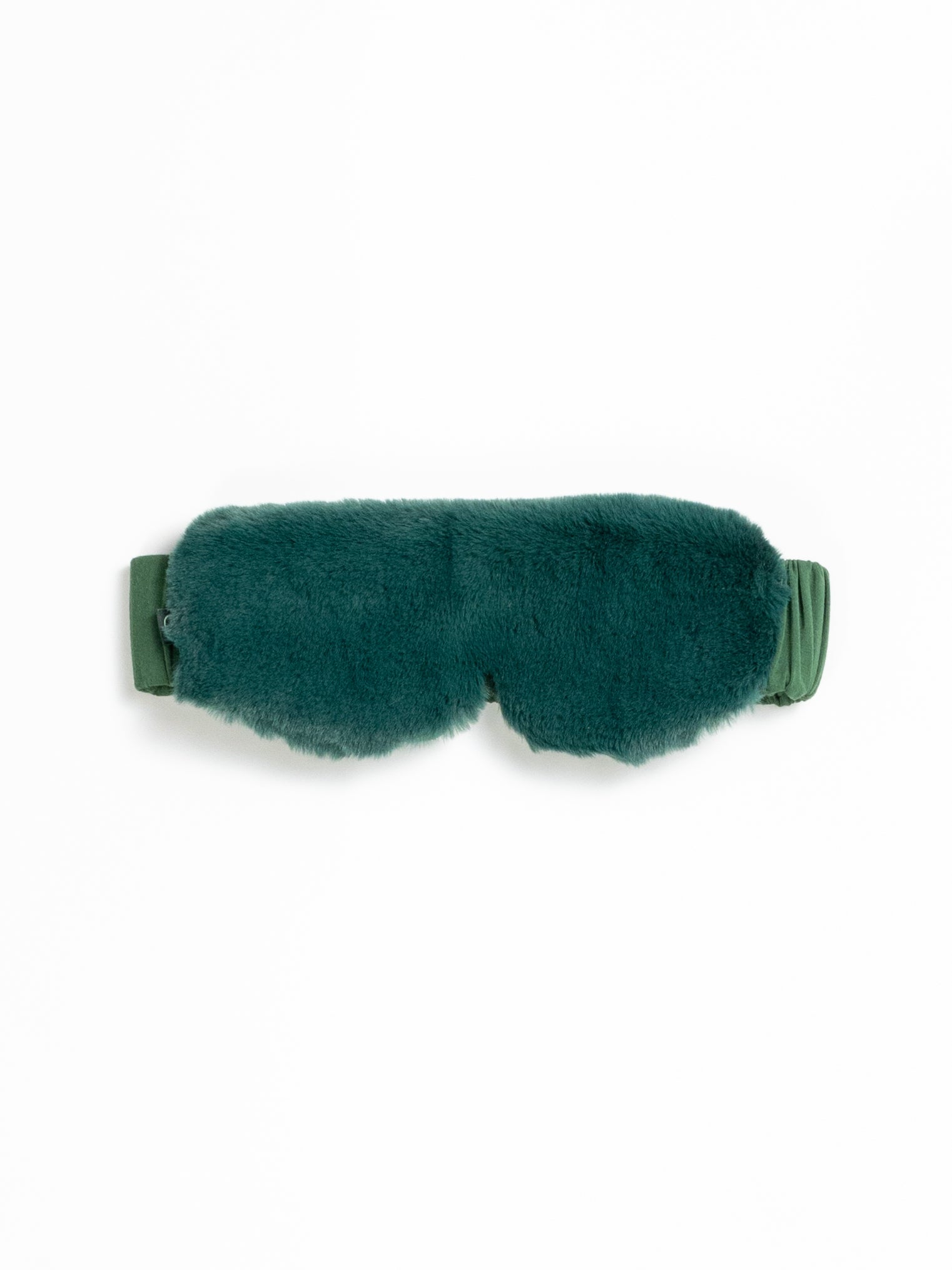 The Cozy Earth Faux Fur Sleep Mask in Jade is pictured on a white background.
