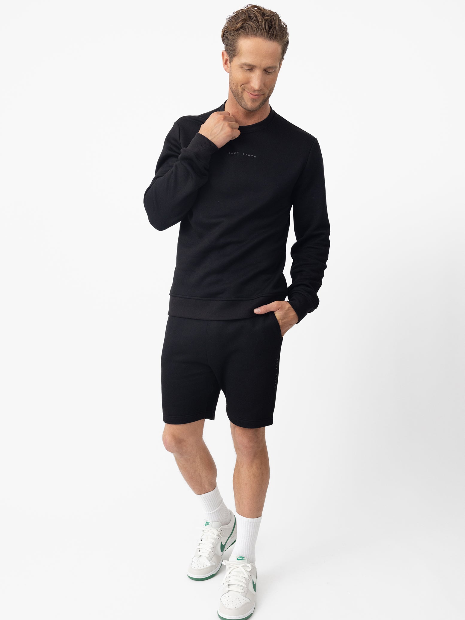 Man wearing black cityscape pullover and shorts with white background |Color:Black