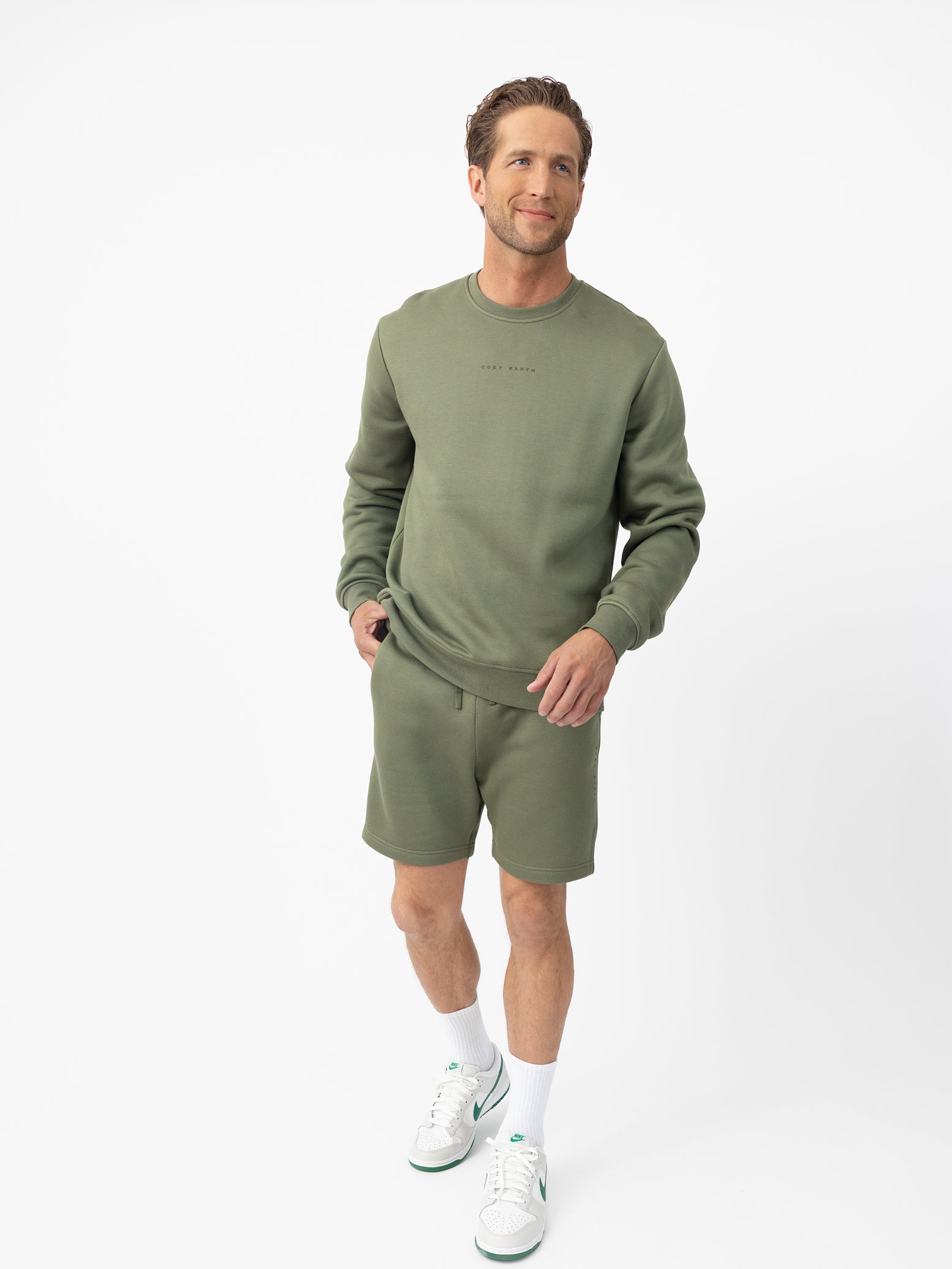 Man wearing Juniper CityScape Shorts with white background