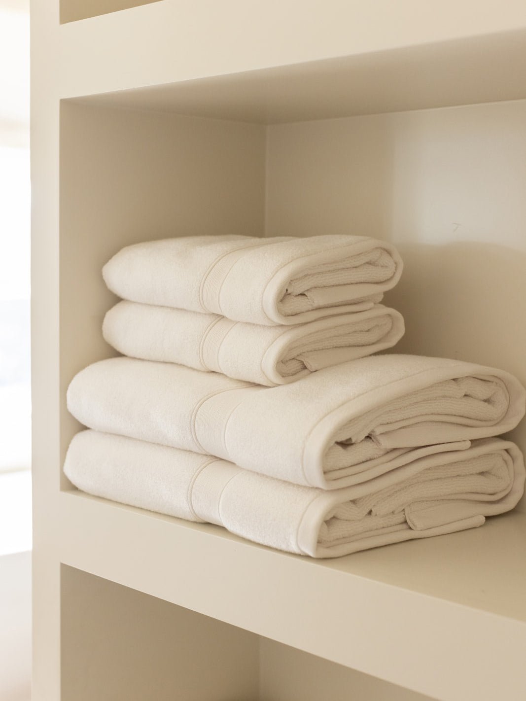 Seashell towels folded on shelf |Color:Seashell