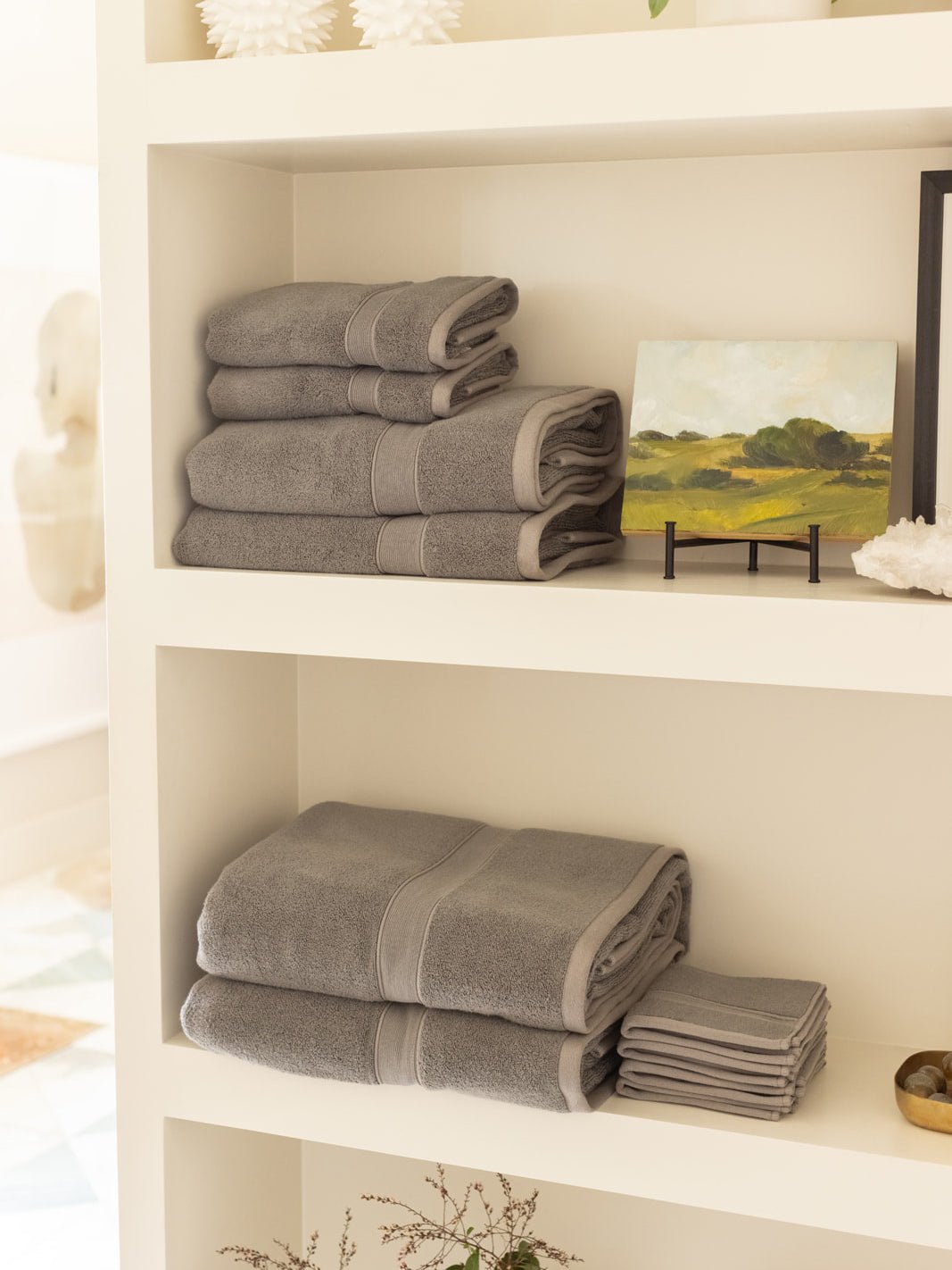 Complete luxe bath bundle folded on shelves 