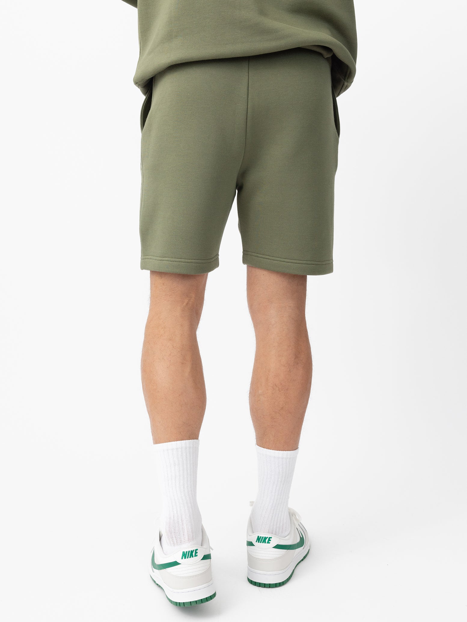 Man wearing Juniper CityScape Shorts with white background