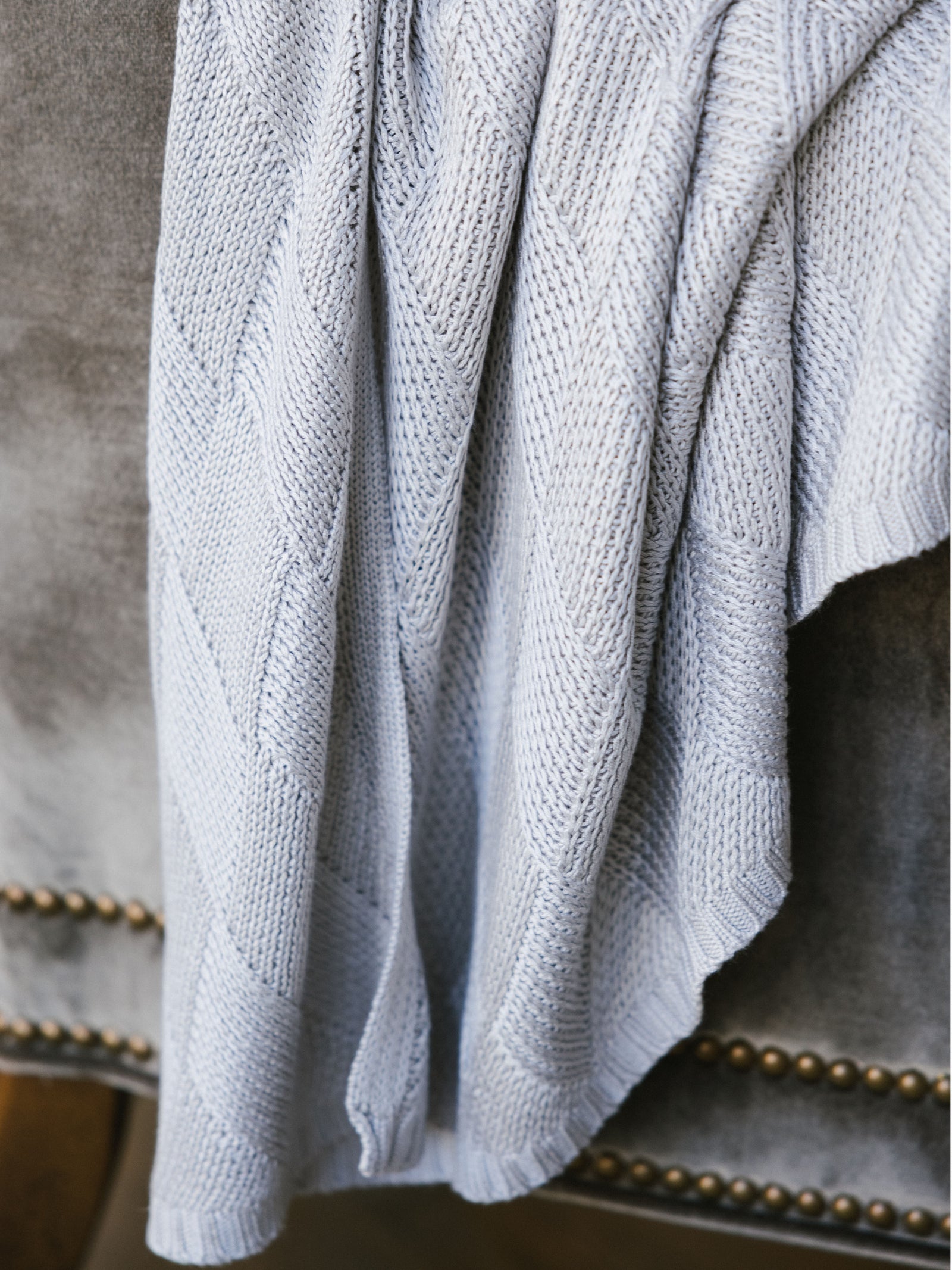 Light Grey Diamond Knit Blanket photographed close up. 