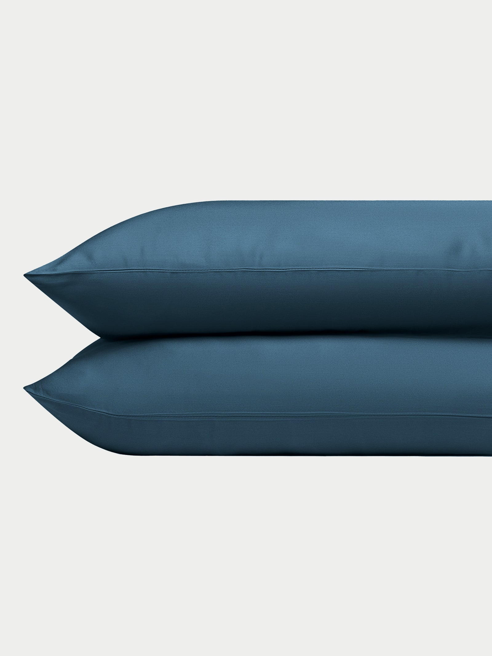 Two pacific blue pillowcases with plain background standard/king/body