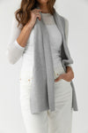 Person wearing a light grey scarf, white sweater, and light-colored pants on a white background |Color:Light Grey