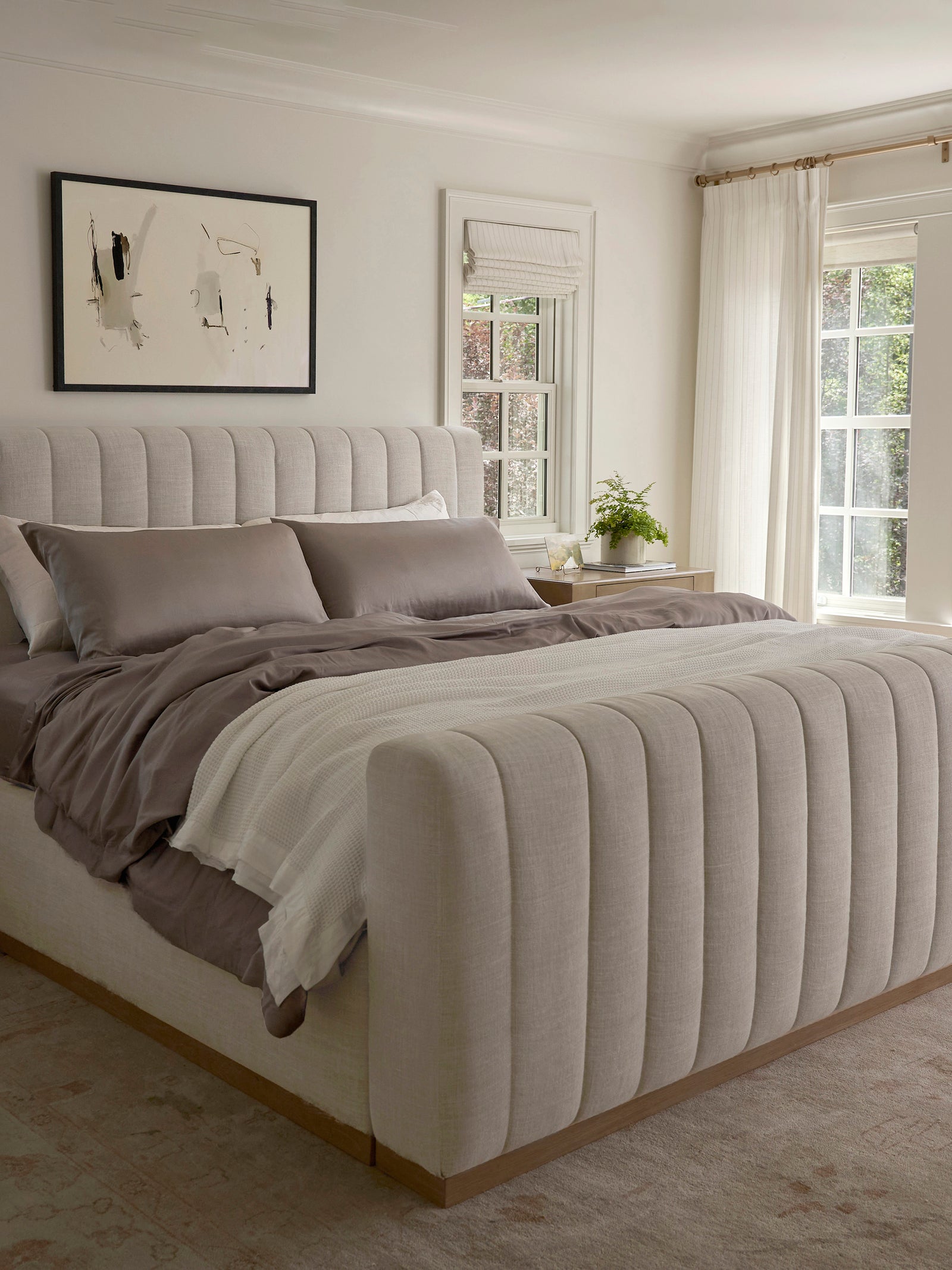 Zoomed out image of bed made with stone bedding 