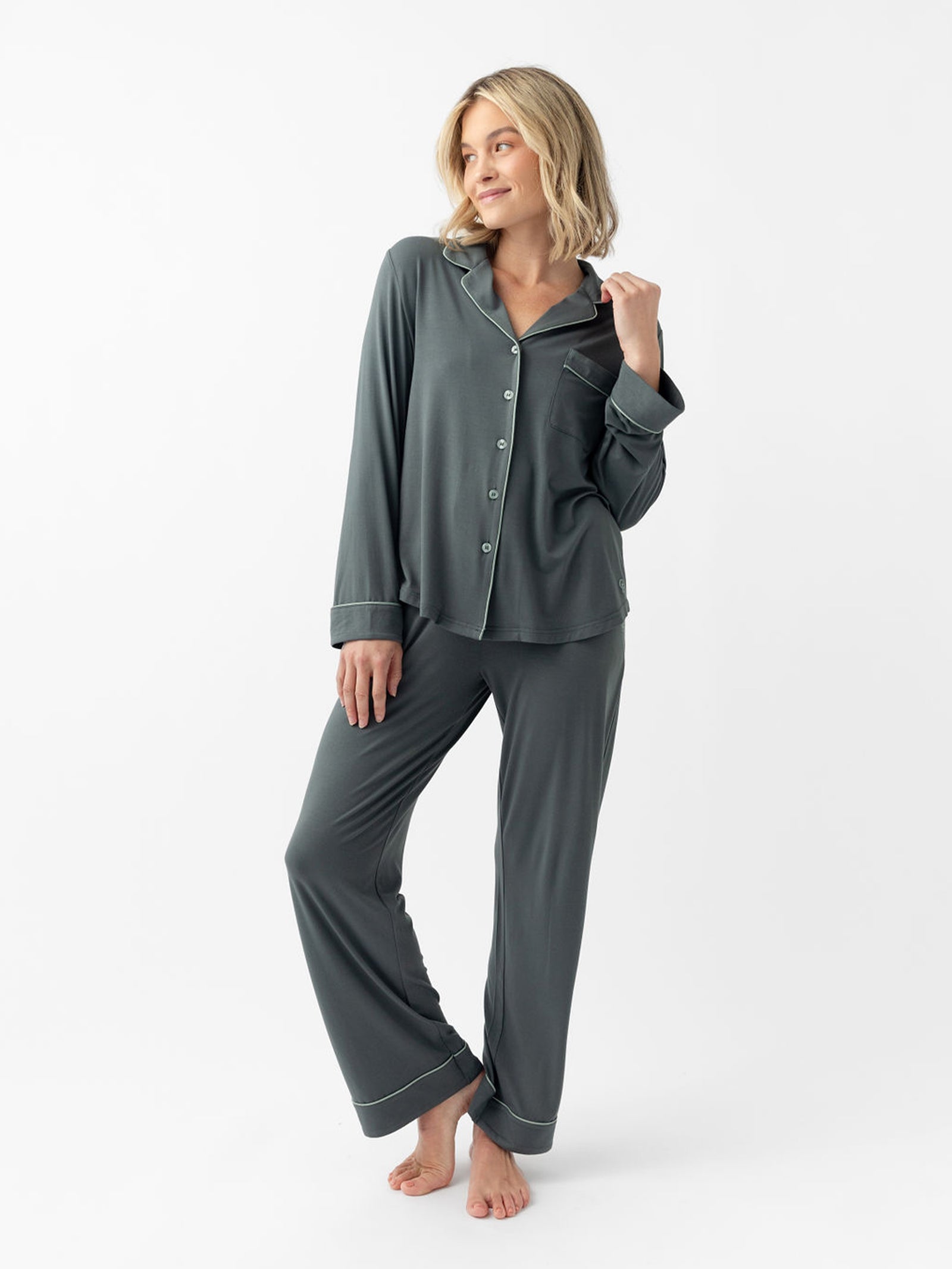 Woman wearing storm pajama pants with white background 