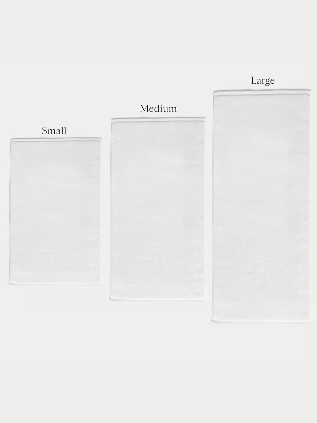 Three Cozy Earth Loop Terry Bath Mats of different sizes are arranged side by side on a plain background, labeled from left to right as Small, Medium, and Large.