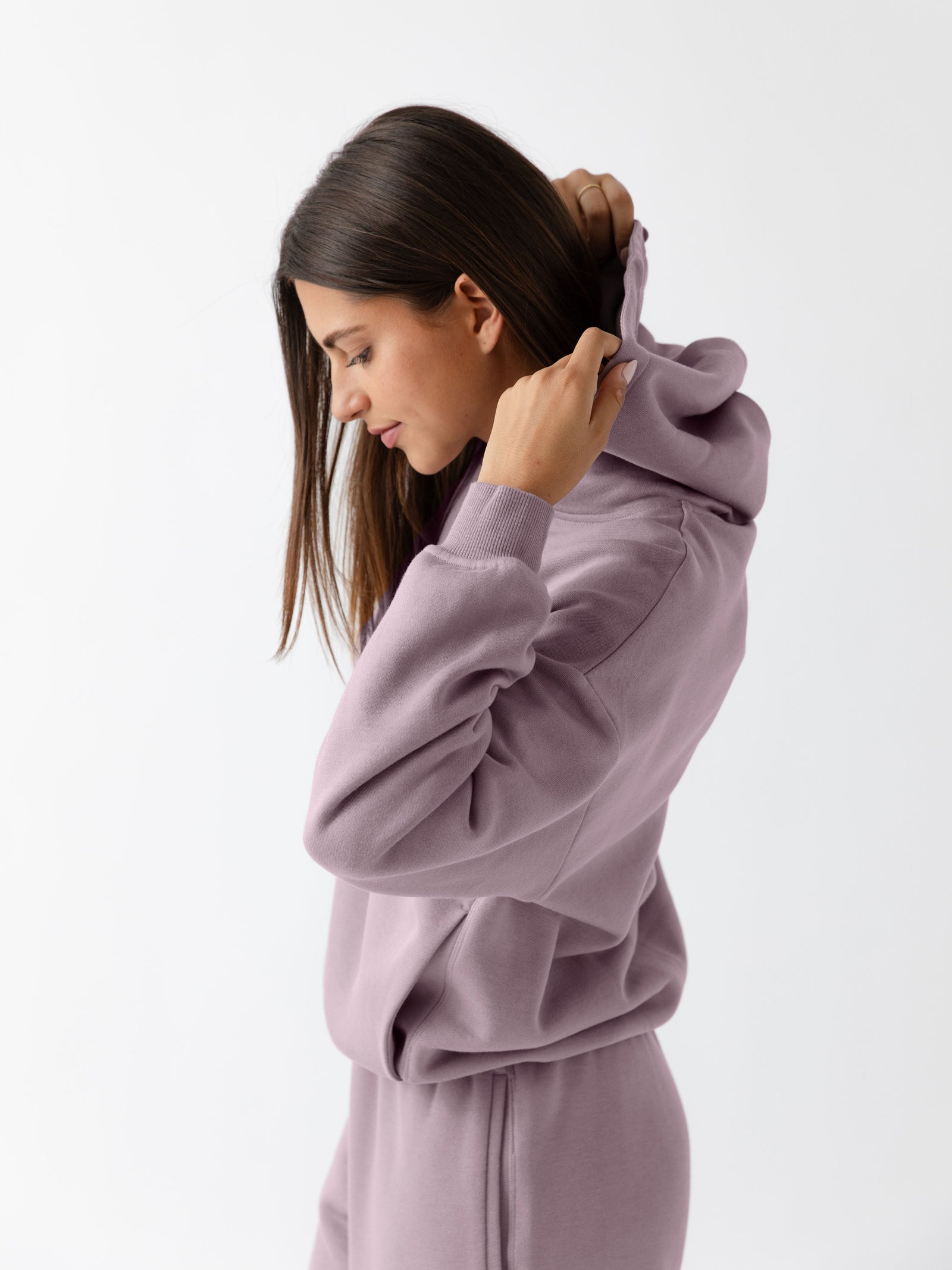Side view of woman wearing dusty orchid cityscape hoodie 